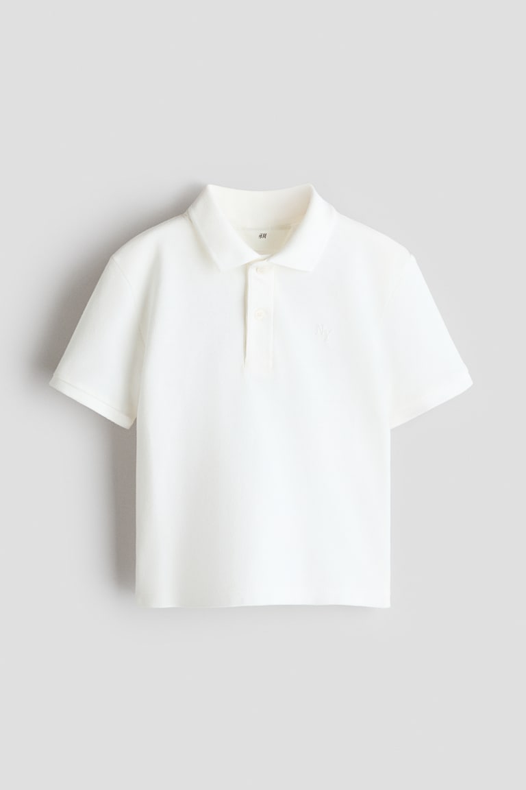 Polo majica od pikea s vezenim motivom