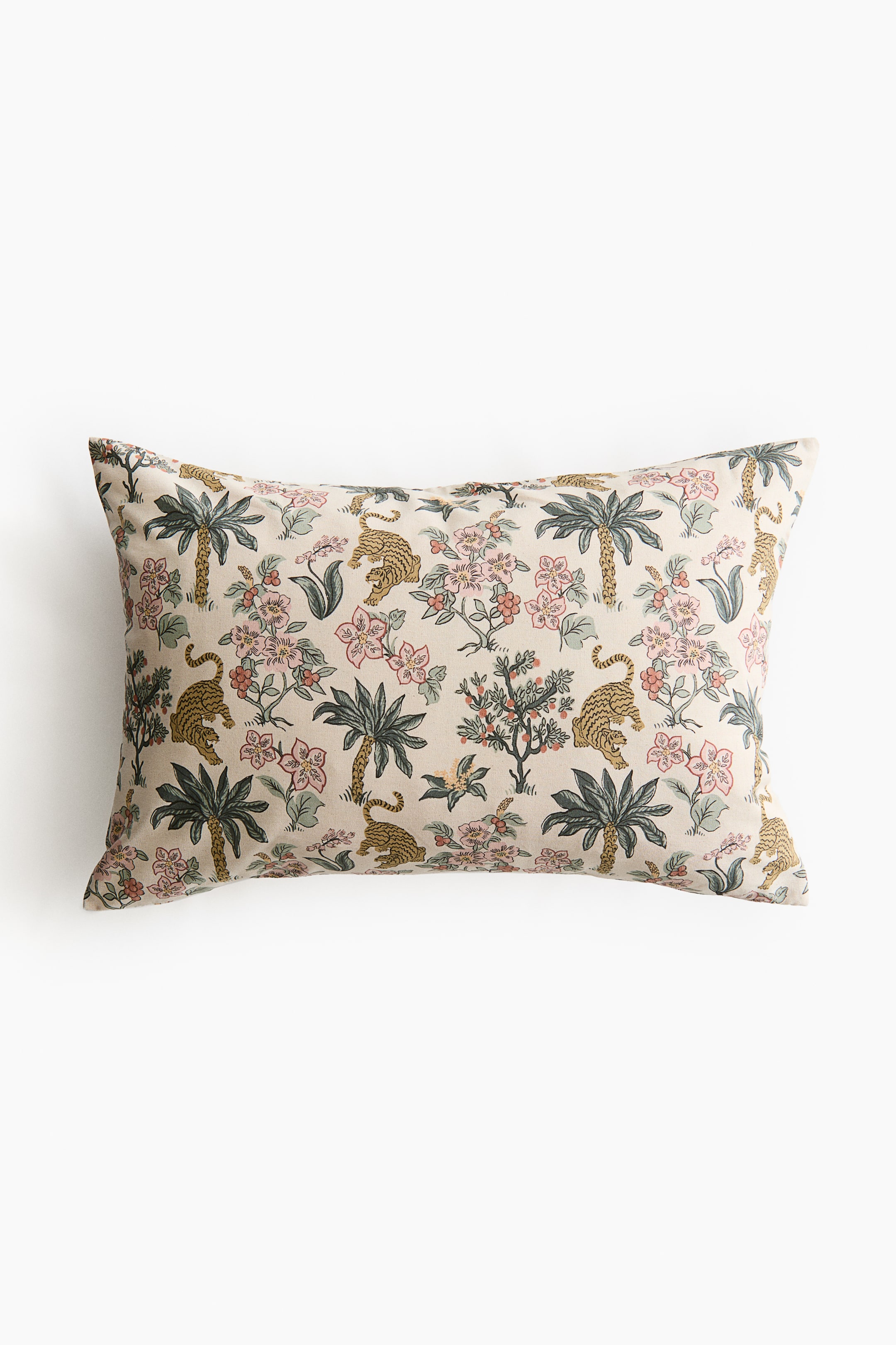 View larger image: A rectangular cushion cover is presented facing the front, featuring an all-over print of golden tigers, green palm trees, and pink and red flowering plants on a light beige background.
