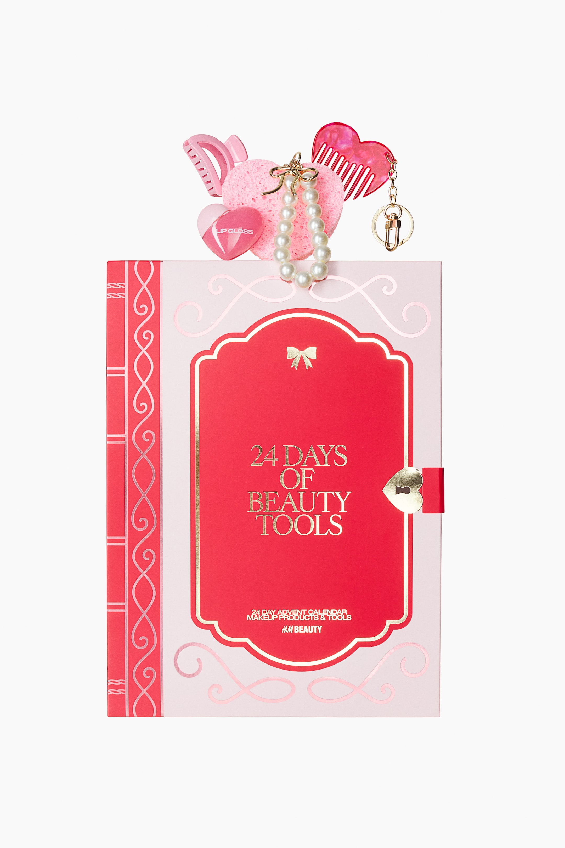 View larger image: The 24-day beauty advent calendar is presented front-facing as a light pink and red rectangular box with gold accents and decorative motifs, featuring the title "24 DAYS OF BEAUTY TOOLS" and a heart-shaped clasp. Its top edge displays various pink beauty tools and accessories, including a heart-shaped lip gloss, a makeup sponge, a hair claw, a comb, a pearl bracelet, and a mini brush keychain.