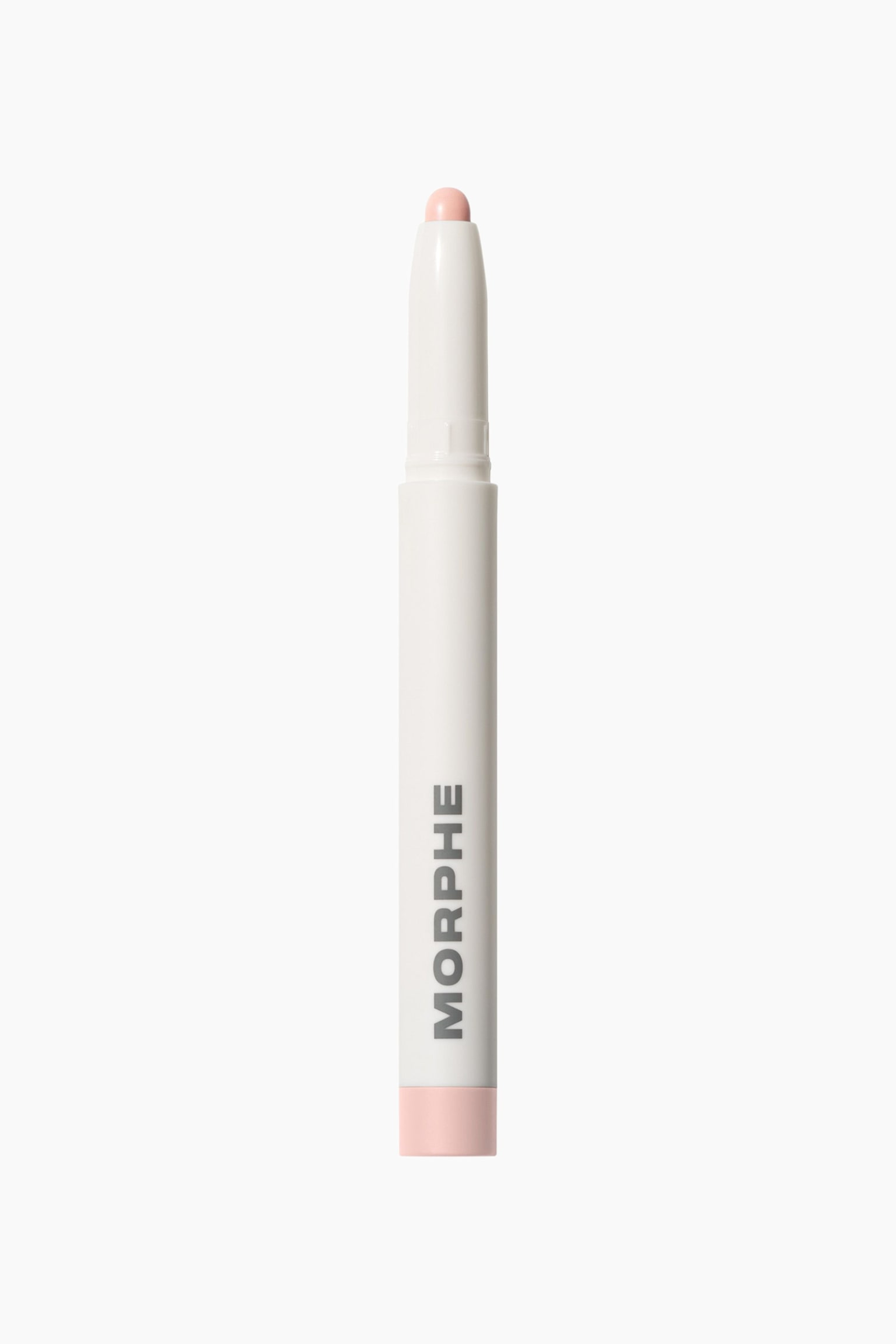 Morphe Shapelifter Micro Brightening Stick stÃ¥r lodrÃ¤tt och visar ett smalt vitt hÃ¶lje med varumÃ¤rkesnamnet tryckt vertikalt i grÃ¥tt. En rundad, ljusrosa produkttipp sticker ut frÃ¥n den avsmalnande Ã¶vre kragen och matchar den ljusrosa bottenkorken lÃ¤ngst ner.