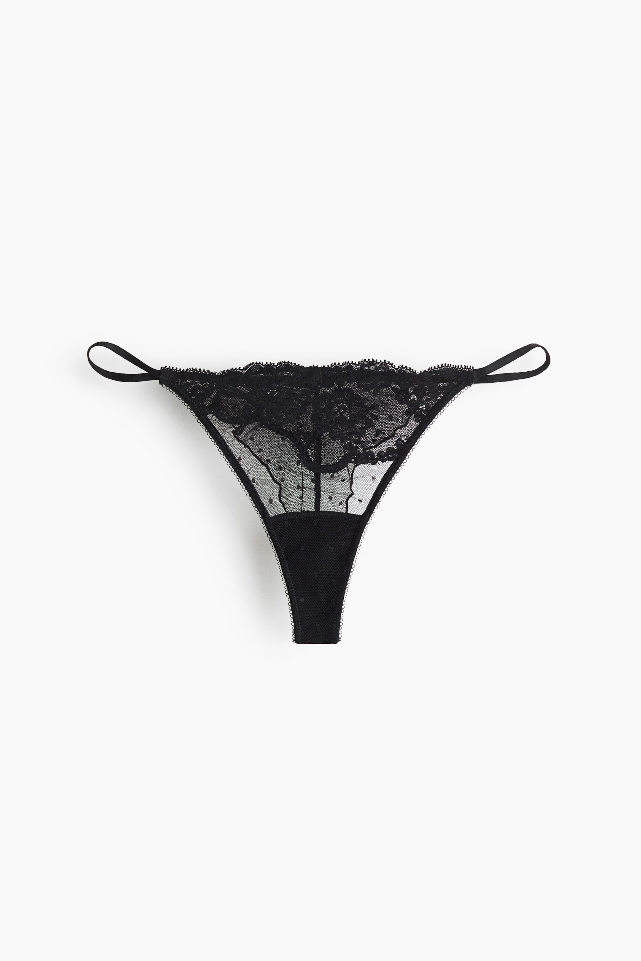 Grotere afbeelding bekijken: Zwarte string slips worden van voren weergegeven, met een lage taille en smalle zijbandjes. De slips zijn ontworpen met een kanten rand langs de bovenkant, een gestippeld mesh-paneel eronder, en een gevoerde inzet aan de onderkant.