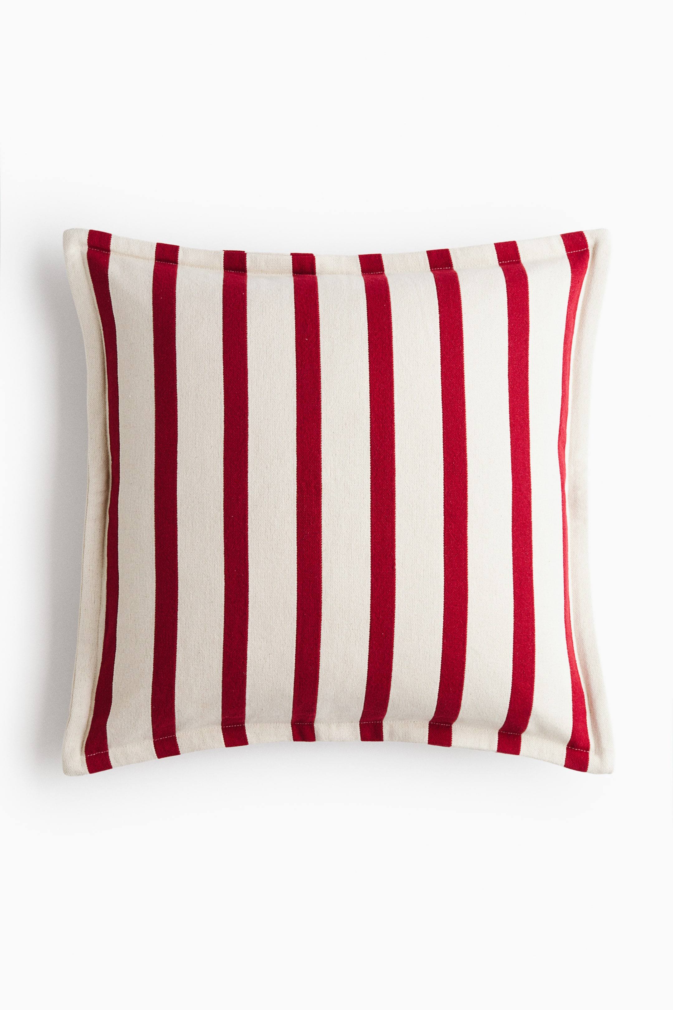 View larger image: A square cotton canvas cushion cover is shown from the front, displaying a pattern of vertical red and off-white stripes. The cover features a stitched flange border along its outer edges.