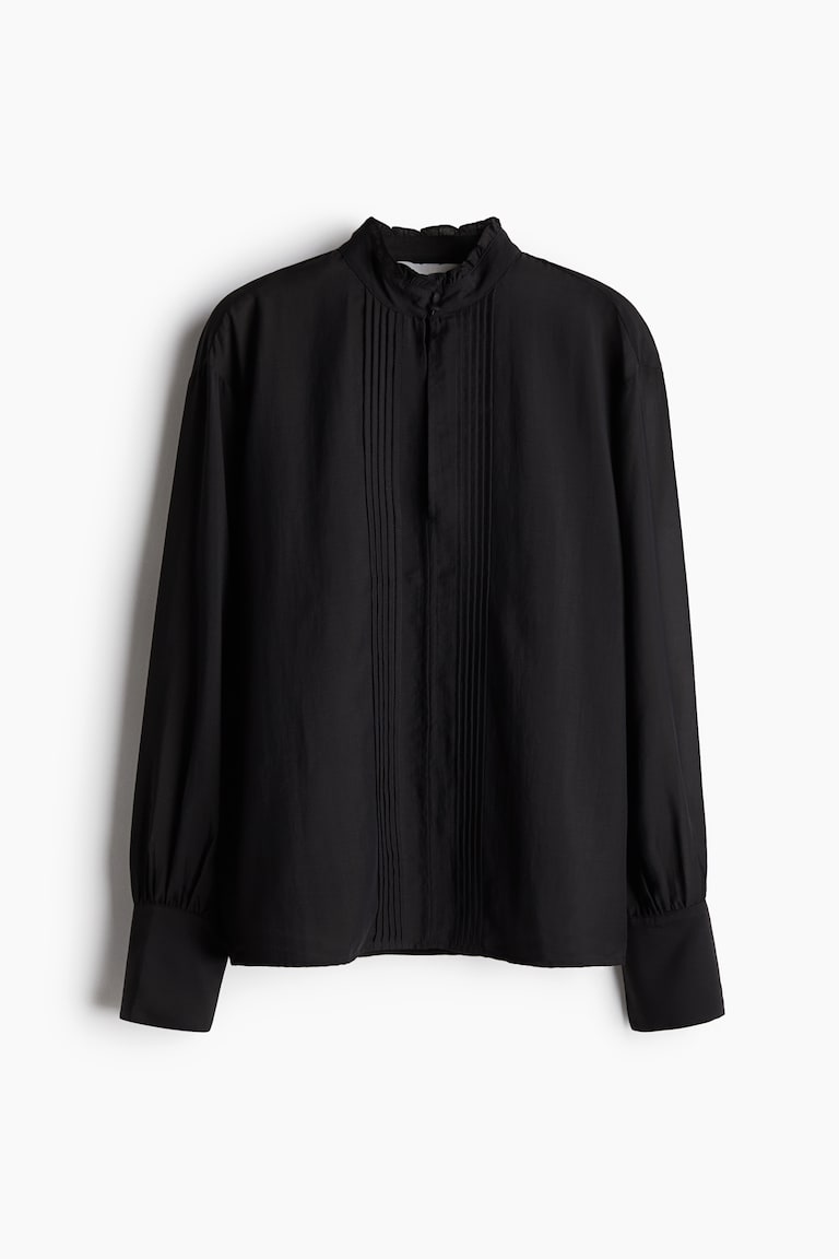 Prozirna bluza s uskim faltama