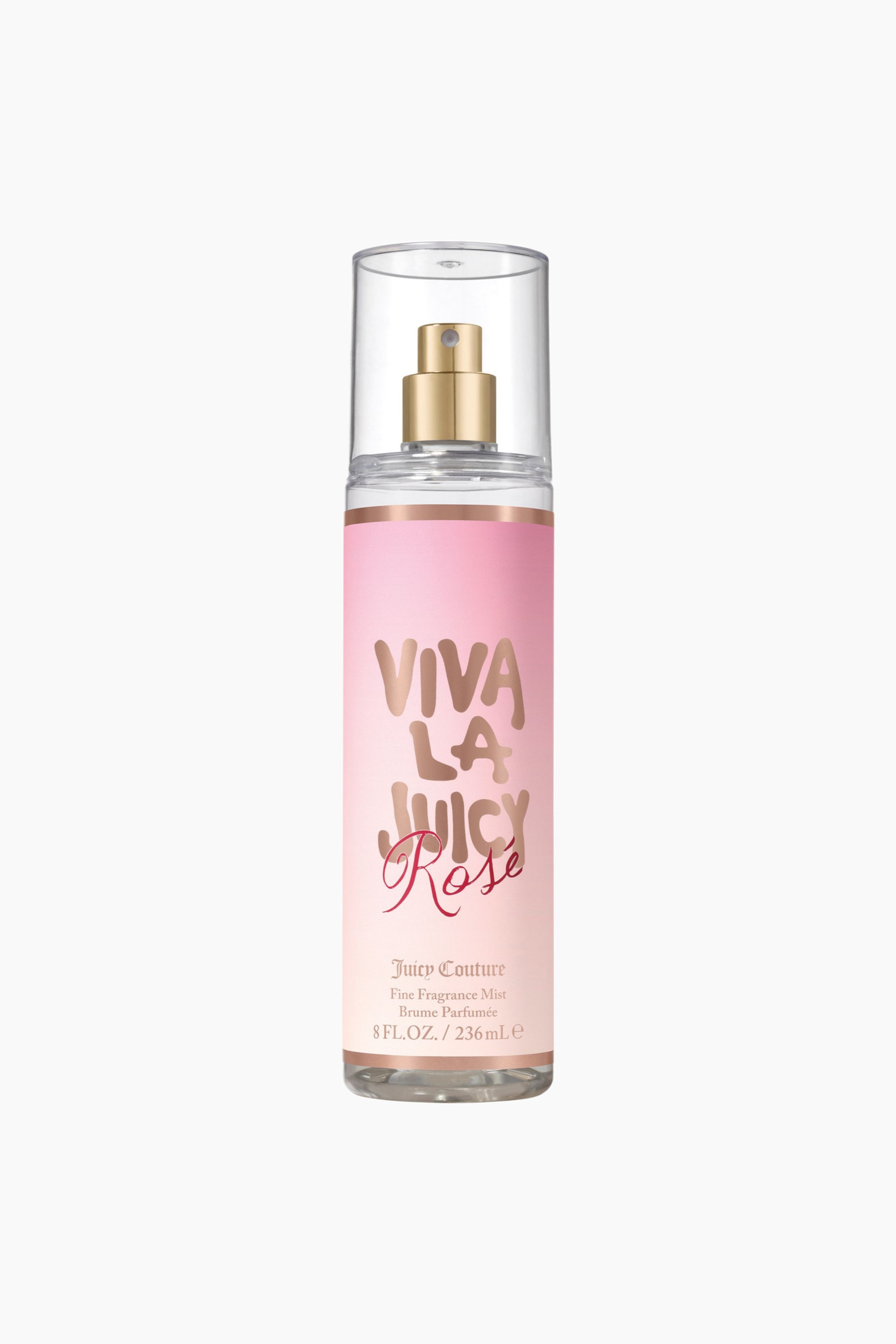 Vis større bilde: En klar sylindrisk duftmistflaske står oppreist, med en rosa gradientetikett som viser "Viva La Juicy Rose" i gull- og rosa skrift. En gullspraydyse er synlig under en klar hette, med et tynt gullbånd som omslutter toppen av etiketten.