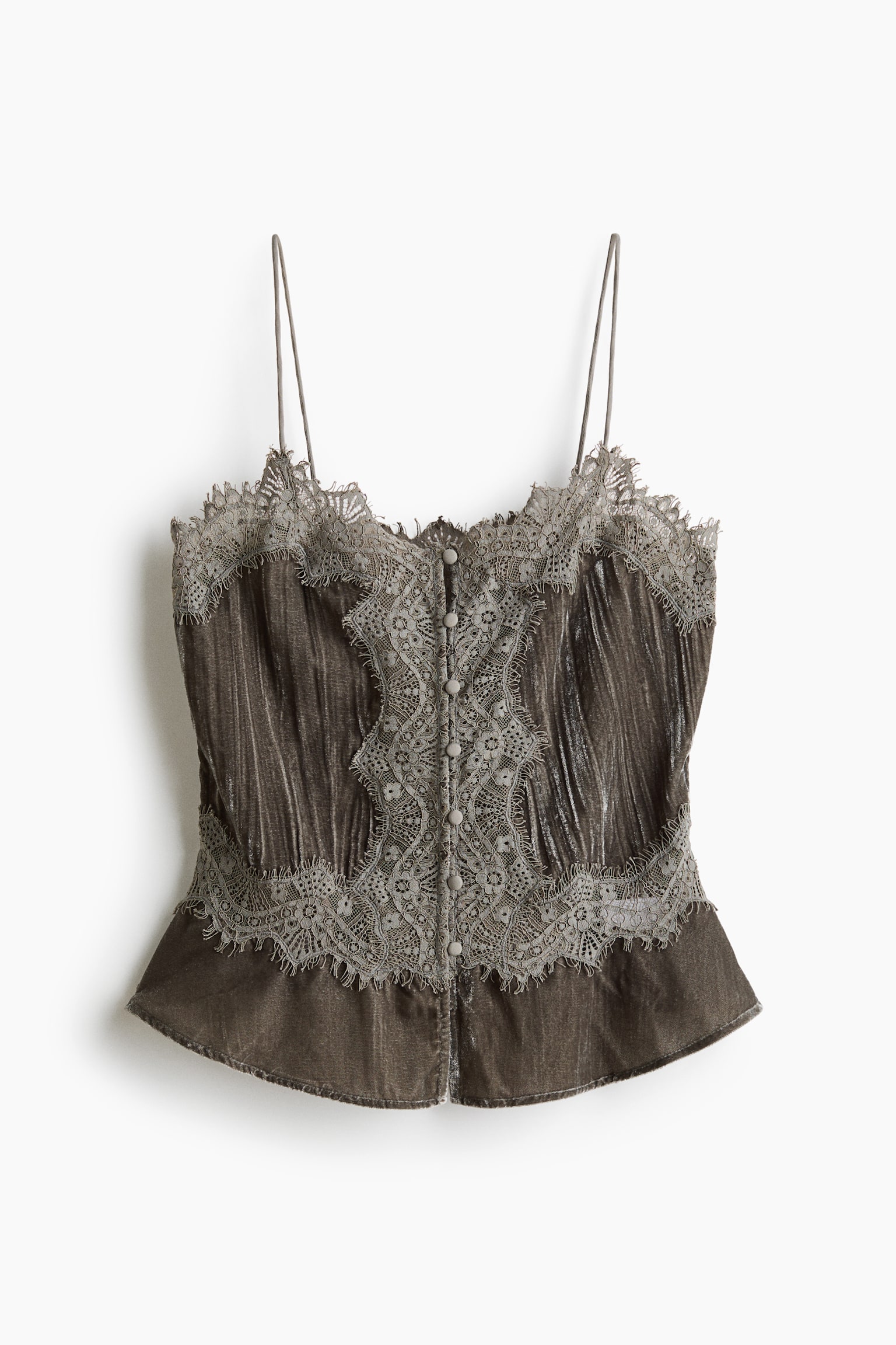 Showing a front view, this short, fitted top in brown crushed velvet features a V-neckline, thin spaghetti shoulder straps, and a flared peplum hem. The design showcases covered buttons down the front, along with detailed scalloped eyelash-stitch lace trims decorating the neckline, centre bodice, and waist.