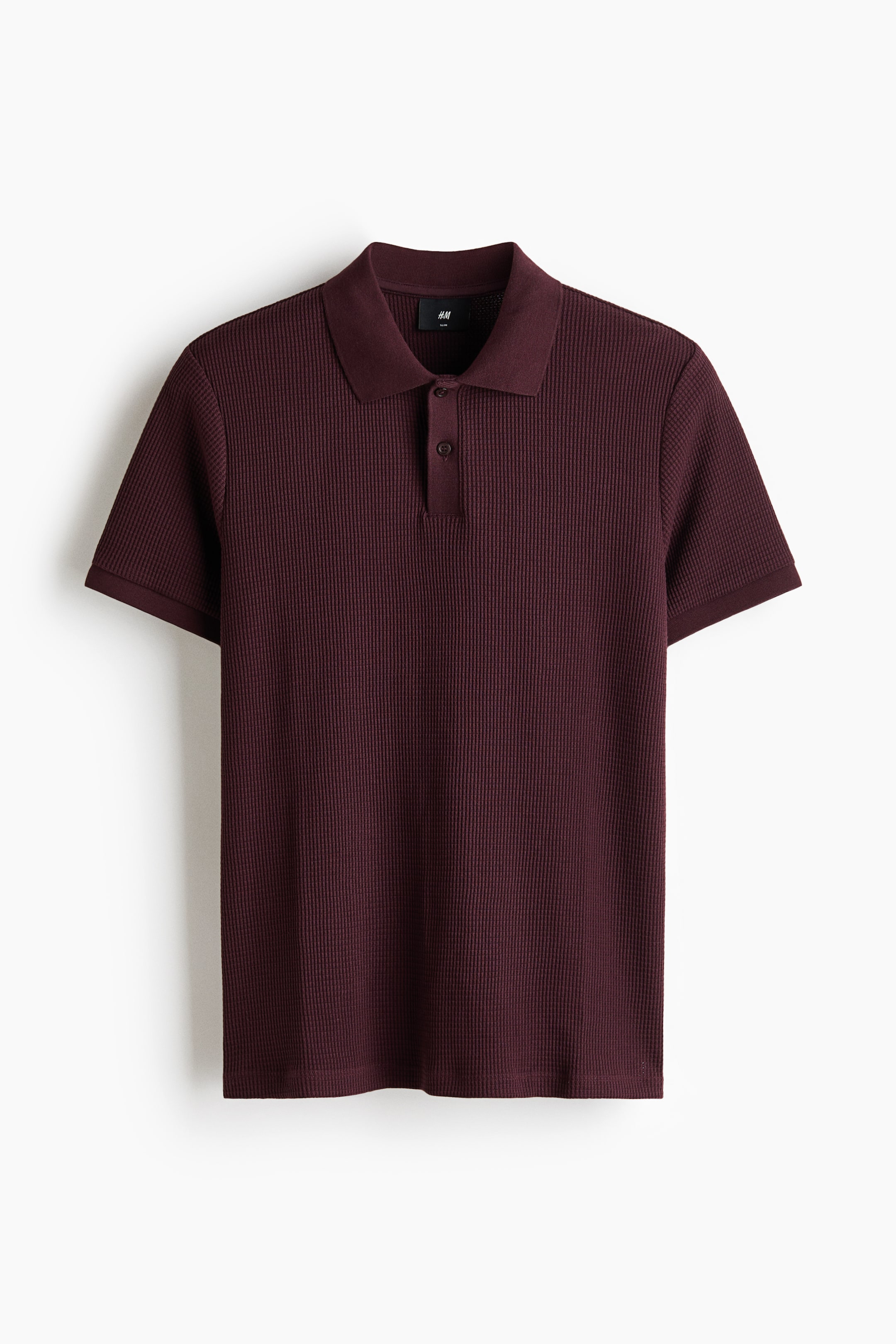 Polo près du corps en tricot gaufré