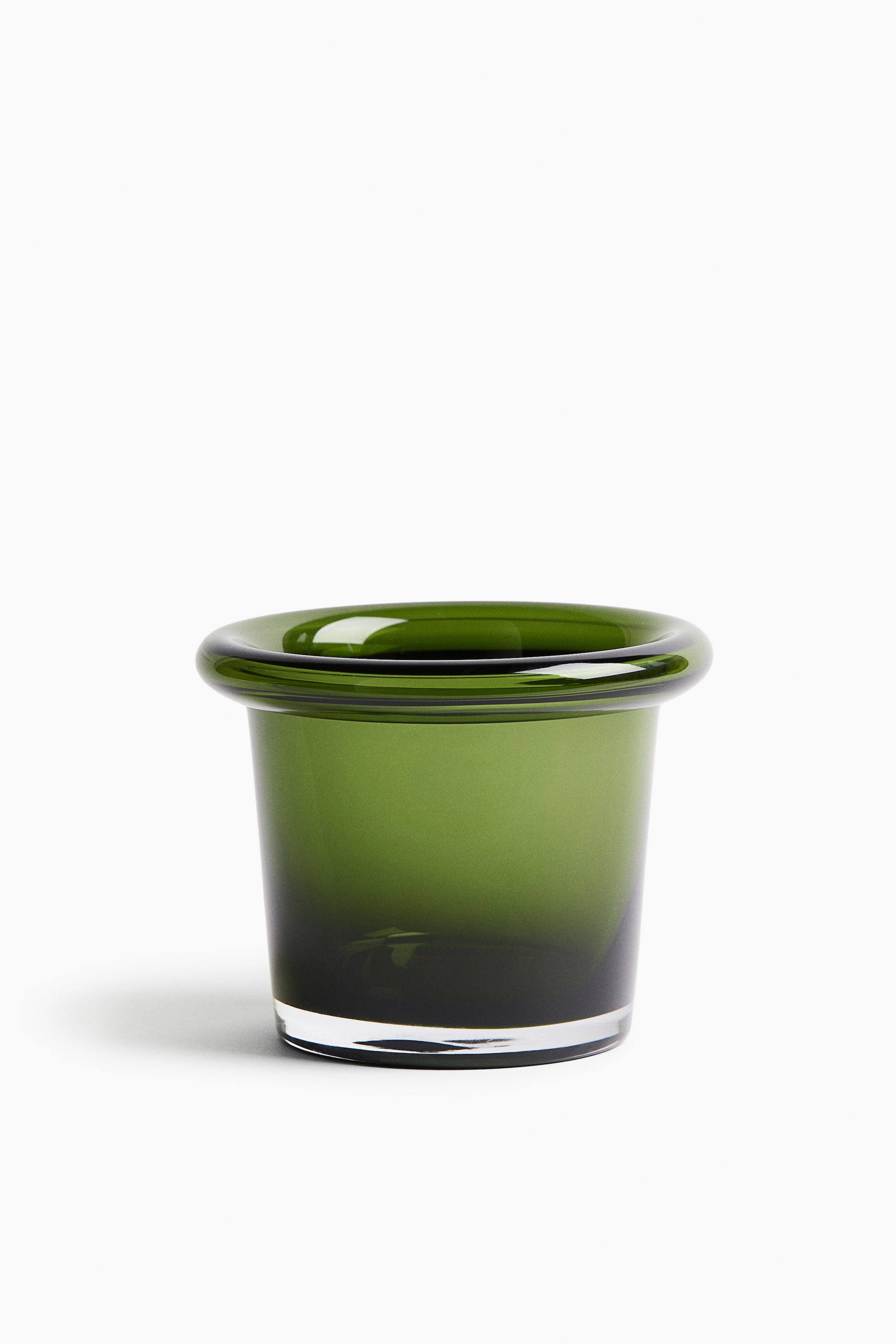 View larger image: A dark green translucent glass container is shown from the front, featuring a cylindrical body that is wider at the top. It has a thick outward-rolled rim and a clear flat base.