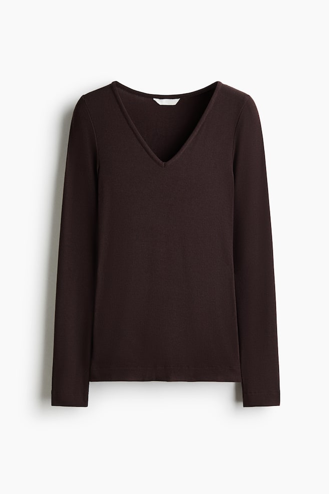 A dark brown, long-sleeved top is facing forwards, displaying a V-neckline and a straight-cut hem in a finely ribbed knit fabric. - 1