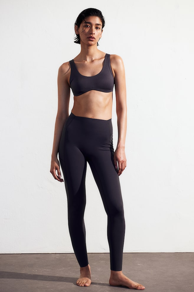 High-waisted shaping leggings, sculpting effect on tummy, hips, and legs -  H&M Sport