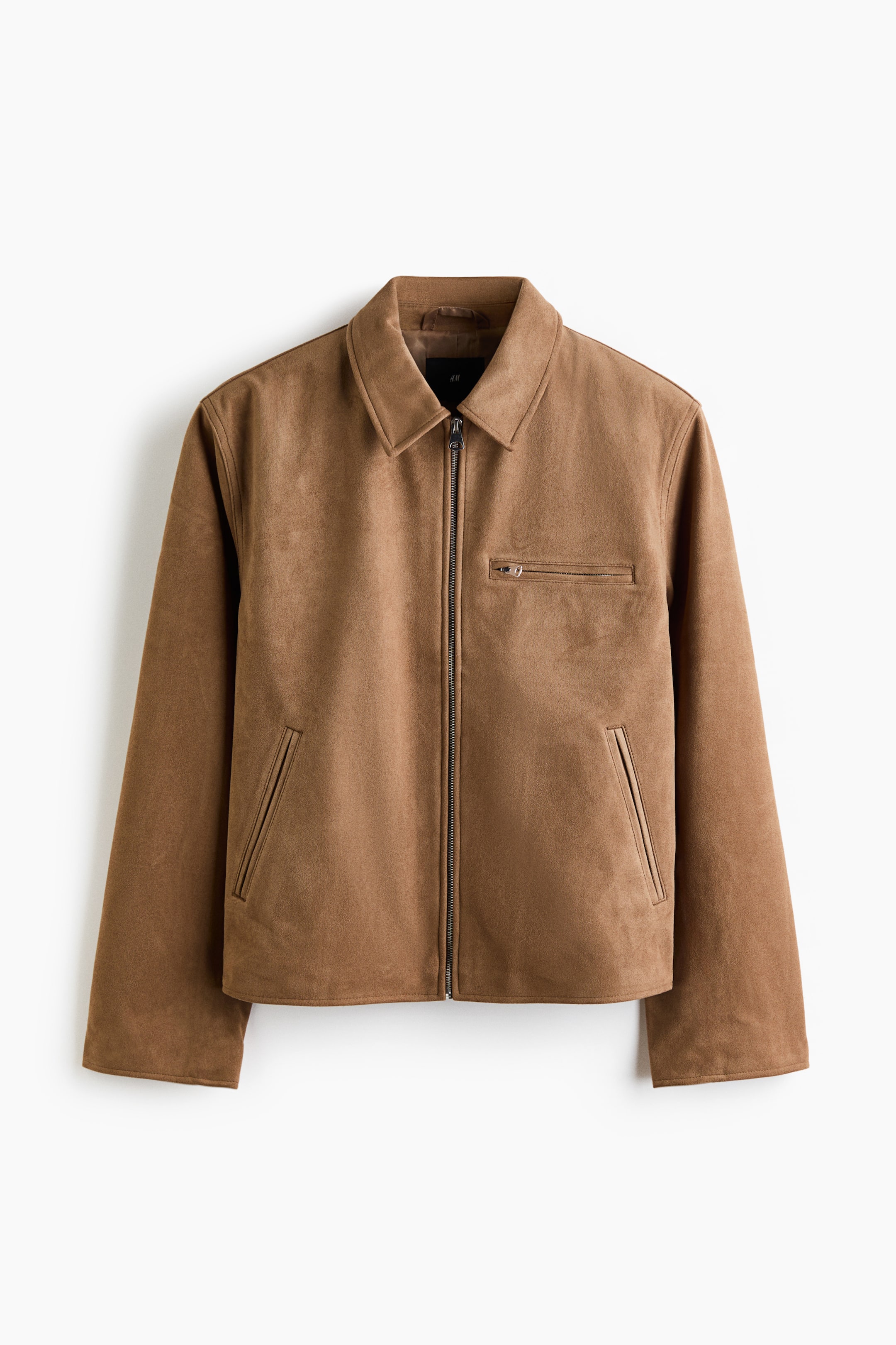 View larger image: A tan, suede-like jacket is showcasing a front view with a full-length dark metal zipper closure. It features a pointed collar, a horizontal zippered pocket on the left chest, and two diagonal welt pockets near the hem.