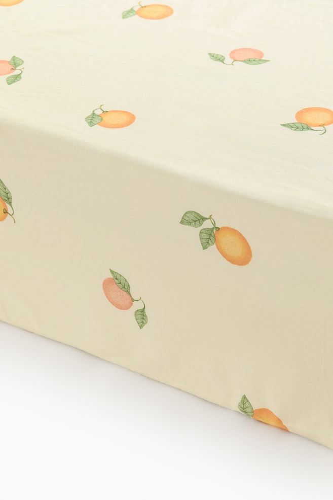 Patterned Cotton Fitted Sheet - Light yellow/oranges/White/dotted/Light green/vehicles/Green/clover/Pink/floral/Light beige/unicorns/Light beige/dinosaurs/Light blue/fish/White/cherries/Light pink/floral/Light taupe/floral - 1