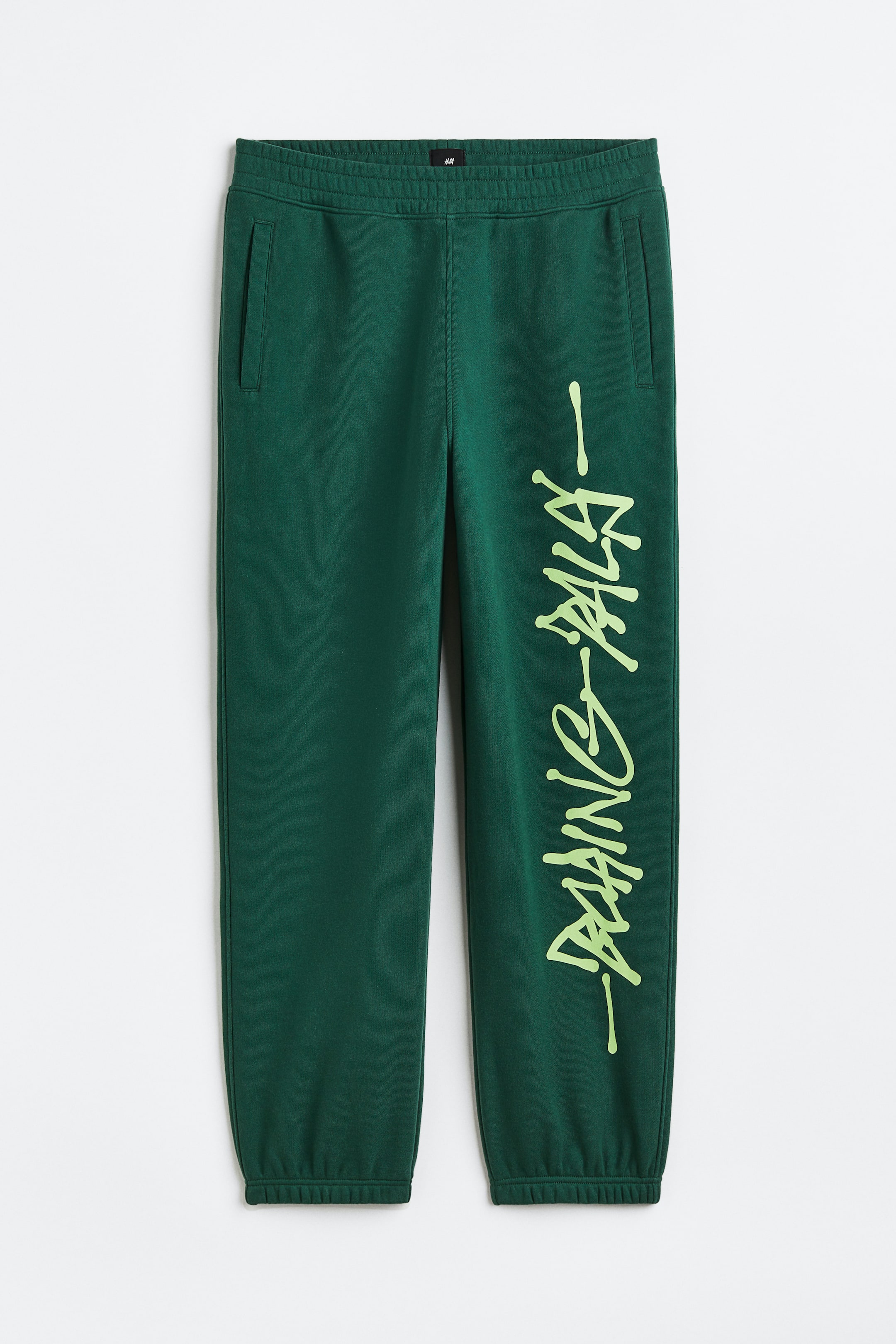 View larger image: Loose Fit Printed sweatpants - Dark green/Boring Pals - Men | H&M 1