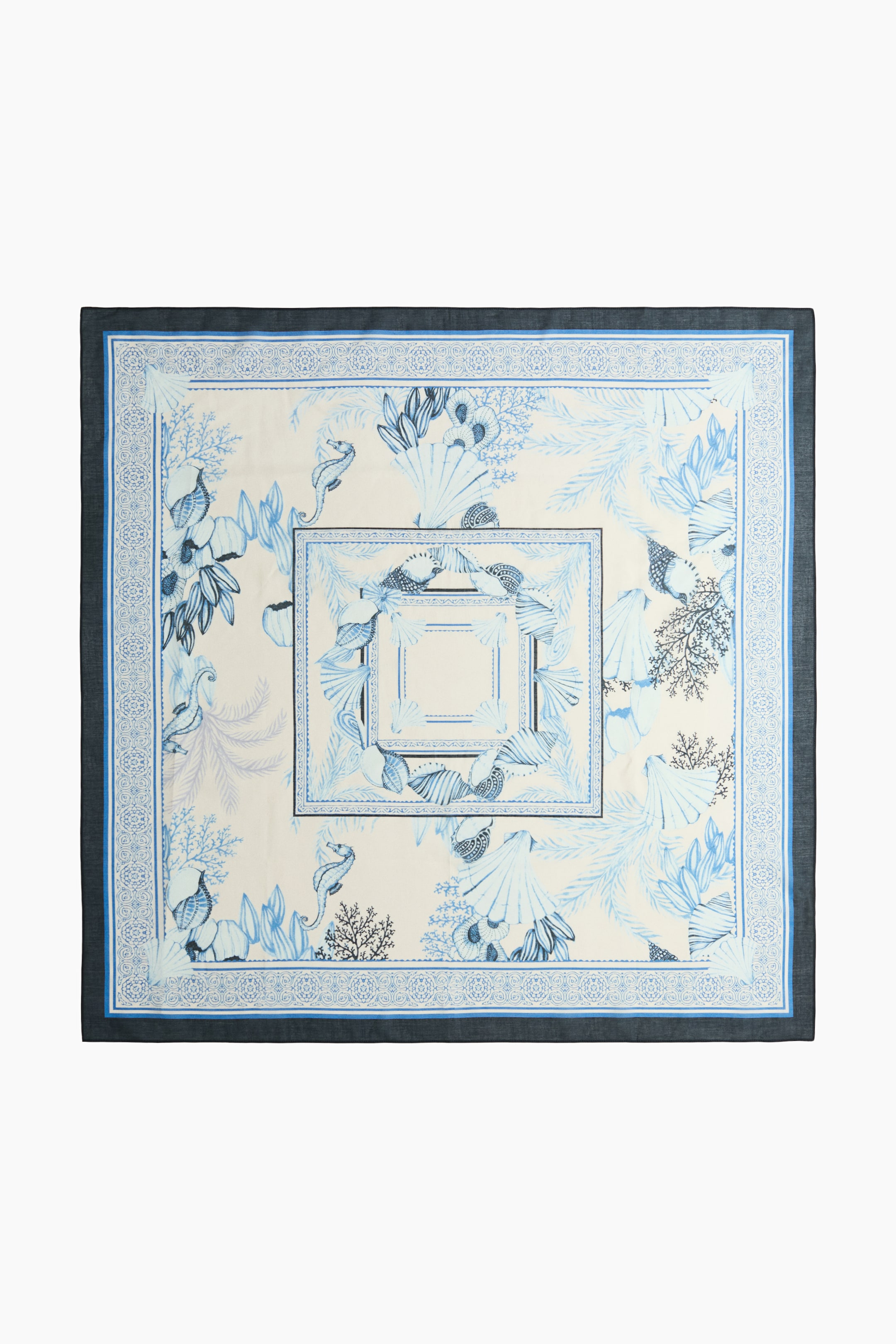 View larger image: A large, square scarf in a soft weave showcases its full front with a printed pattern. The design features blue seahorses, shells, and coral against a light background, intricately framed by multiple borders in varying shades of blue.