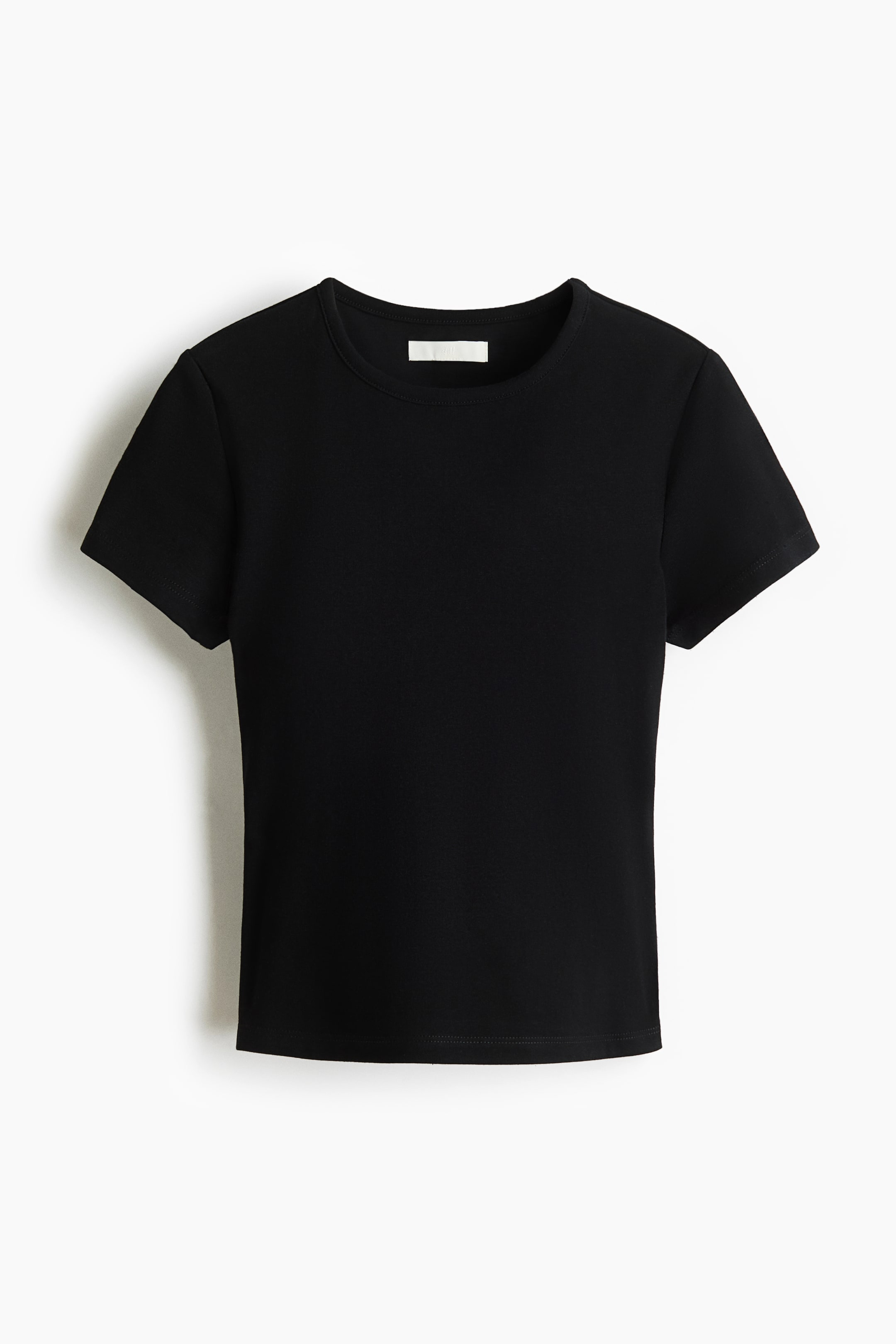 Xem ảnh lớn hơn: Một chiếc áo thun ôm màu đen đang trình bày FRONT, có cổ tròn, tay ngắn và gấu cắt thẳng, được làm từ cotton jersey mềm.