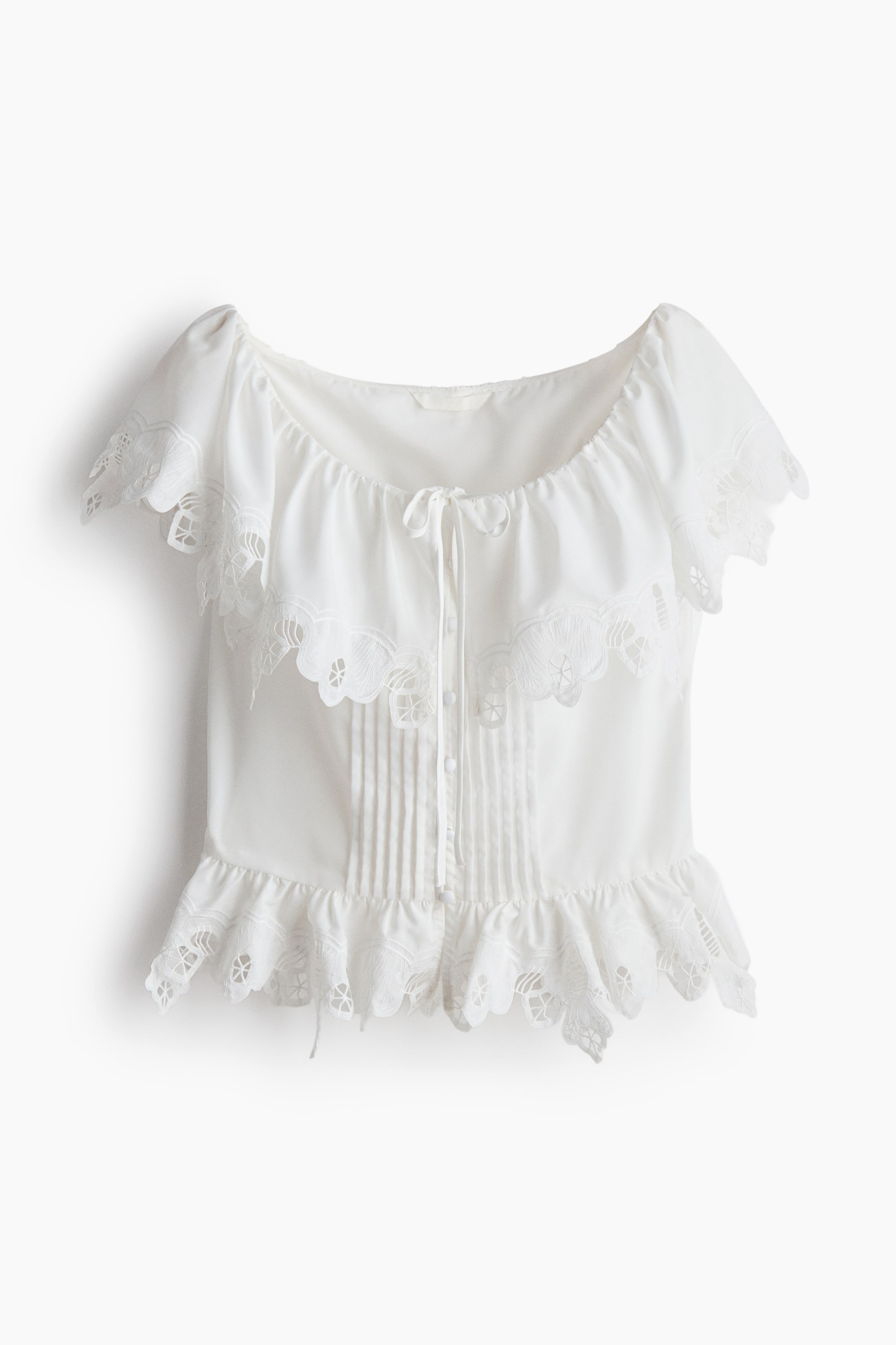 Blouse à volant avec broderie anglaise