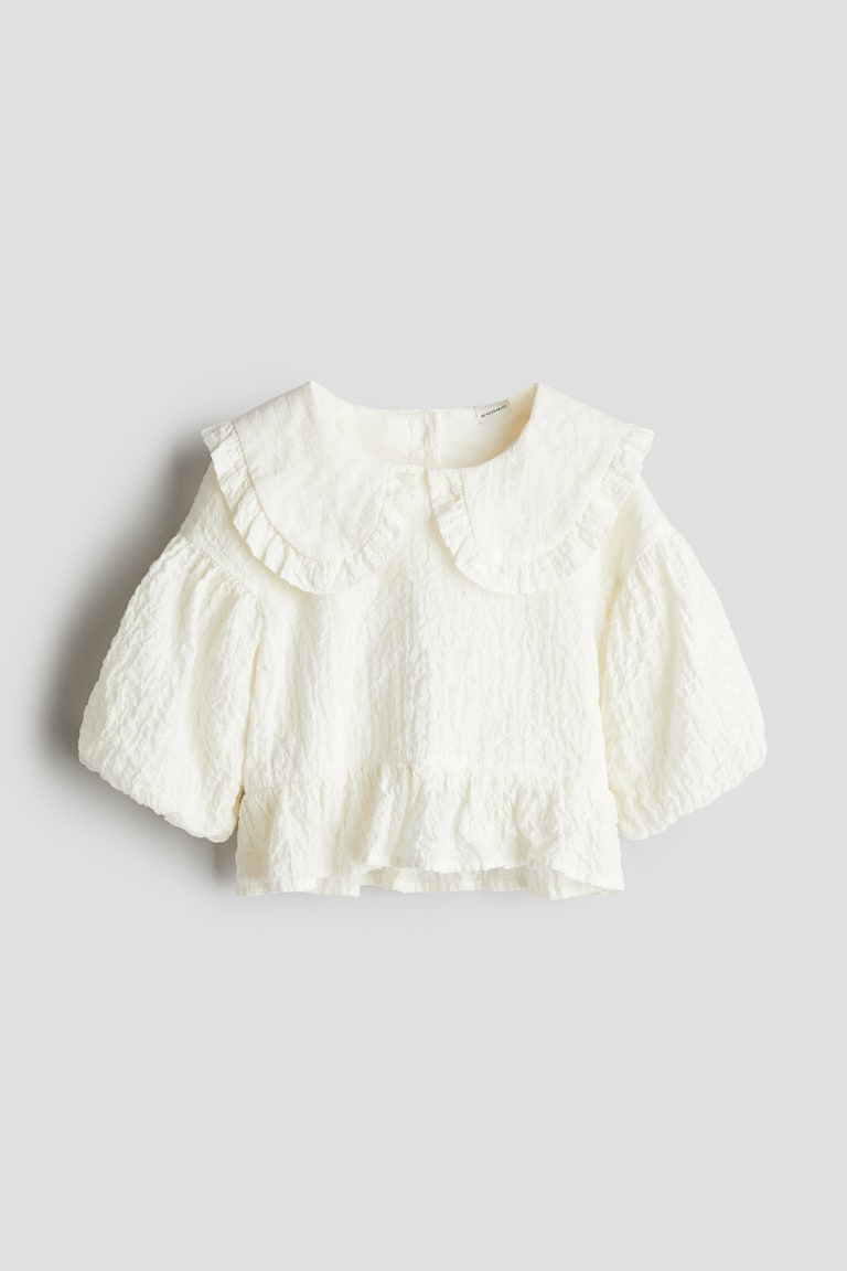 Bluza od sirsakera s puf rukavima