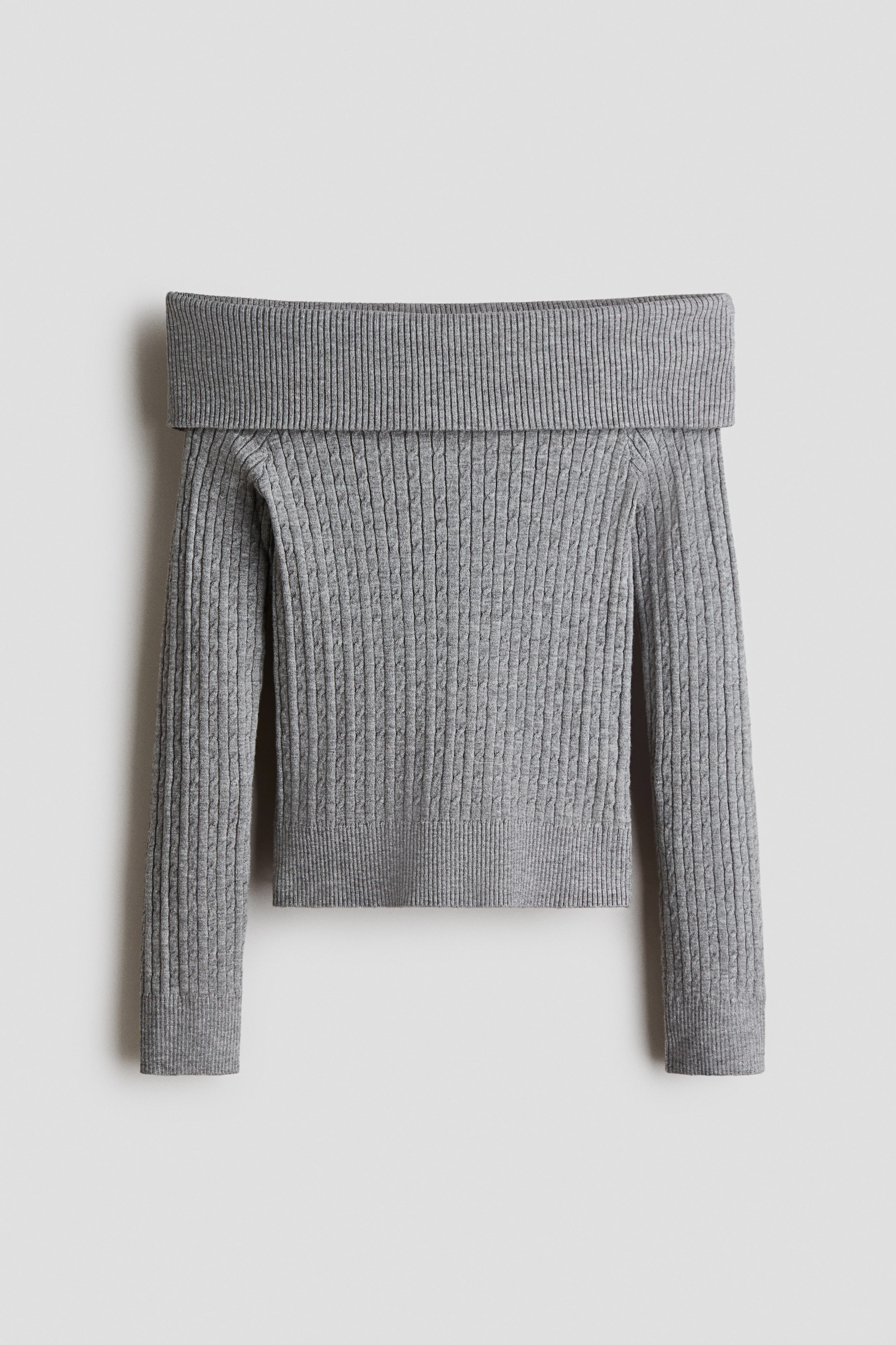 View larger image: Grey off-the-shoulder sweater showcases a wide, ribbed neckline. The main body and long sleeves feature alternating vertical ribbed and subtle cable knit patterns, finishing with ribbed cuffs and a ribbed hem.