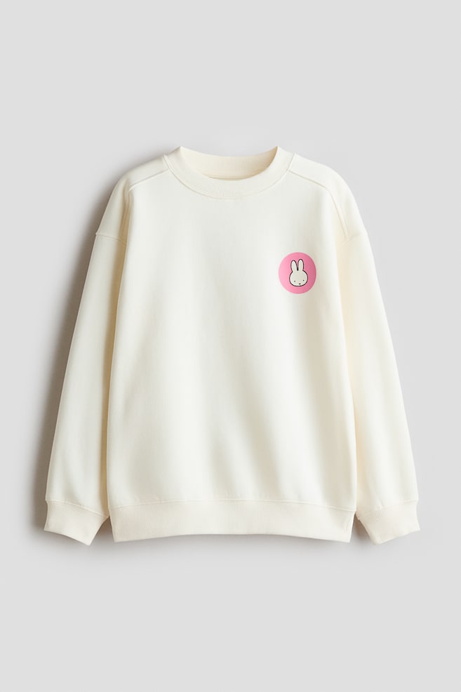 Innen angerautes Sweatshirt mit Print - Cremefarben/Miffy/Pink/SmileyWorld®/Anthrazit/CapyFun/Cream/Mofusand/Weiß/KPop Demon Hunters/Dunkellila/Snoopy/Hellblau/Cinnamoroll - 1