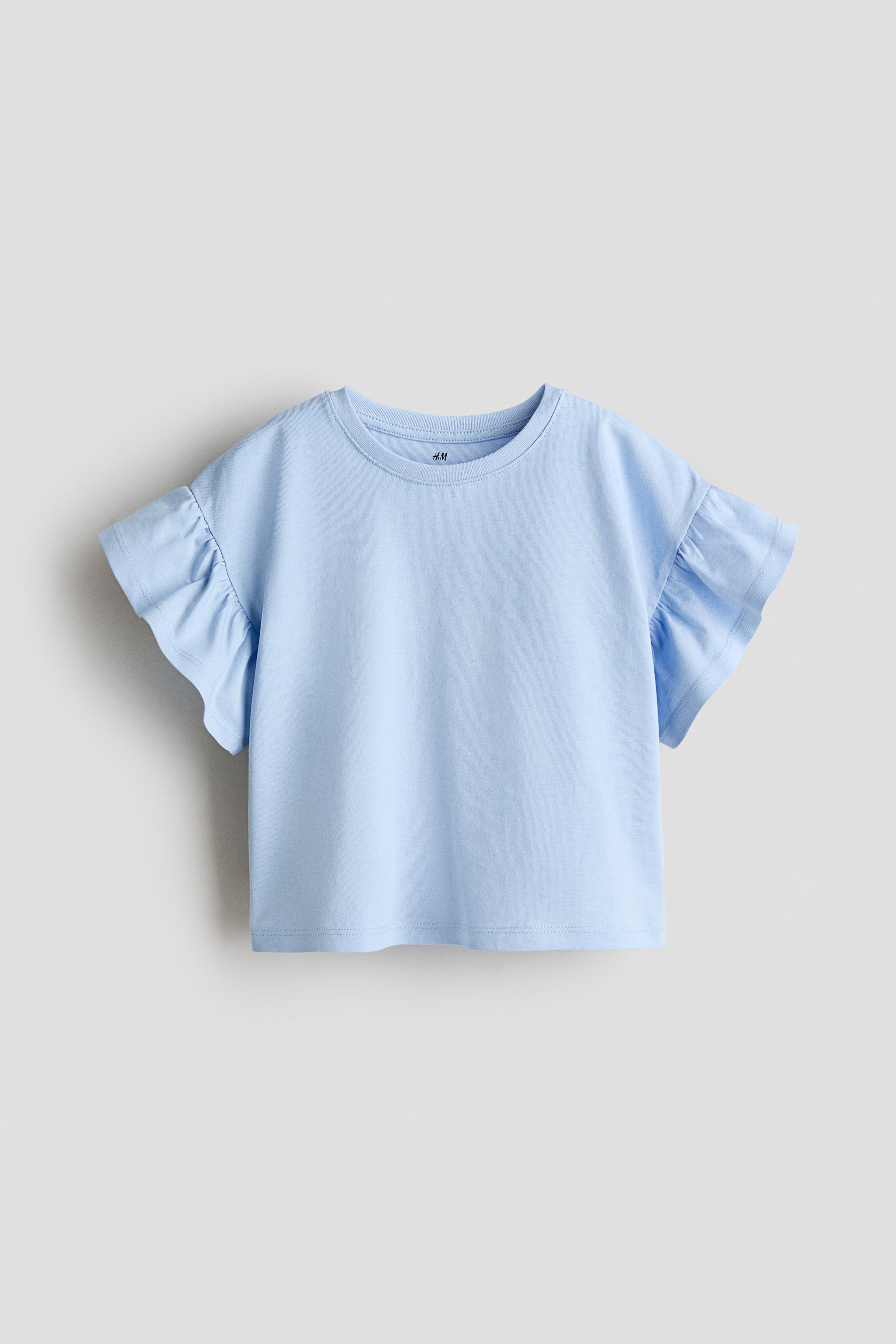 View larger image: A light blue boxy top made from soft cotton jersey is presenting a round, rib-trimmed neckline, low dropped shoulders, and flutter sleeves in a front view.