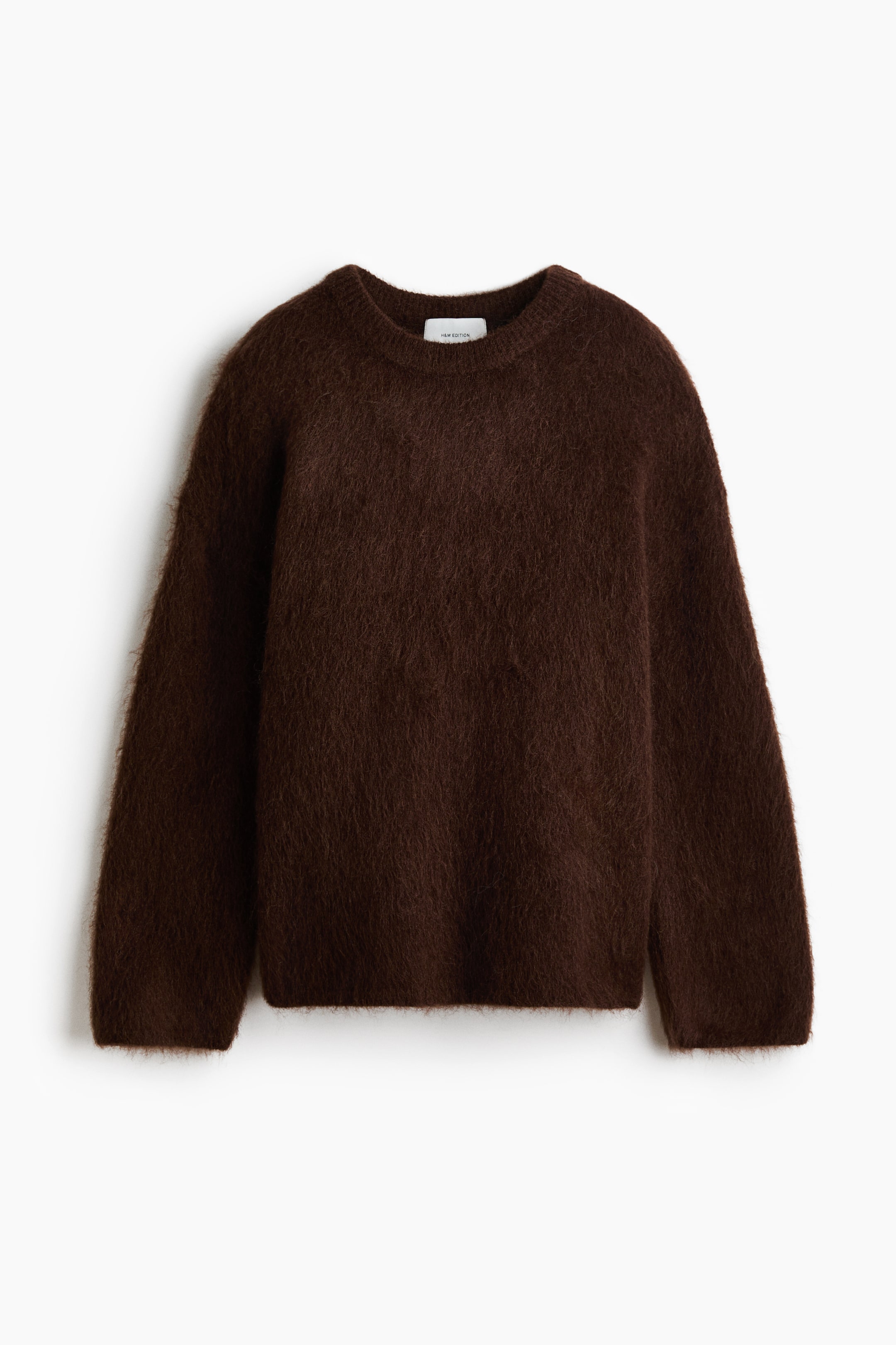 View larger image: A brown oversized jumper is showcasing its front, featuring a soft, fuzzy knit. It is crafted with dropped shoulders, long sleeves, and ribbed accents at the crew neckline, cuffs, and hem.