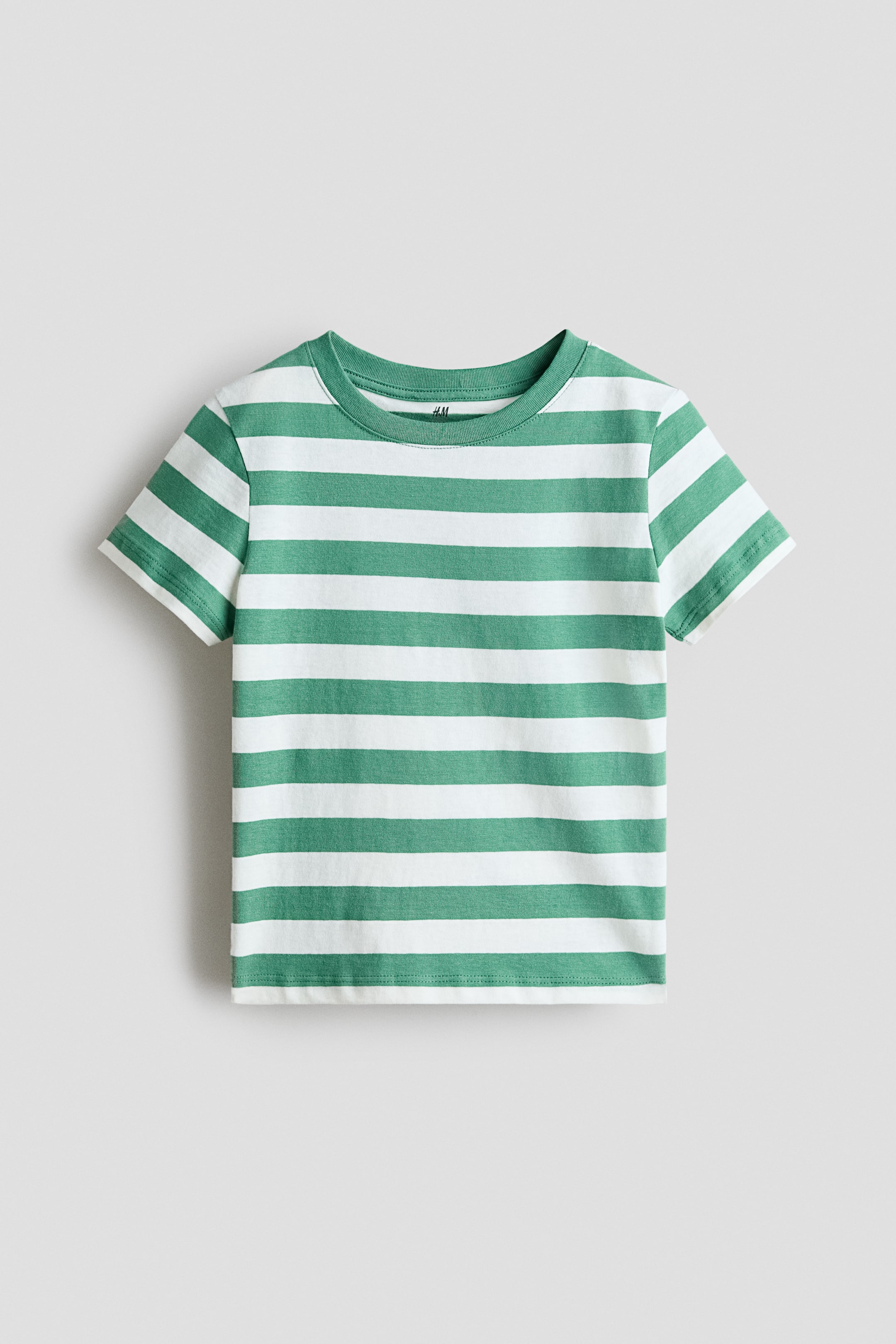 View larger image: The T-shirt is shown from the front, featuring green-and-white horizontal stripes. It is designed with a round, rib-trimmed neckline and short sleeves.