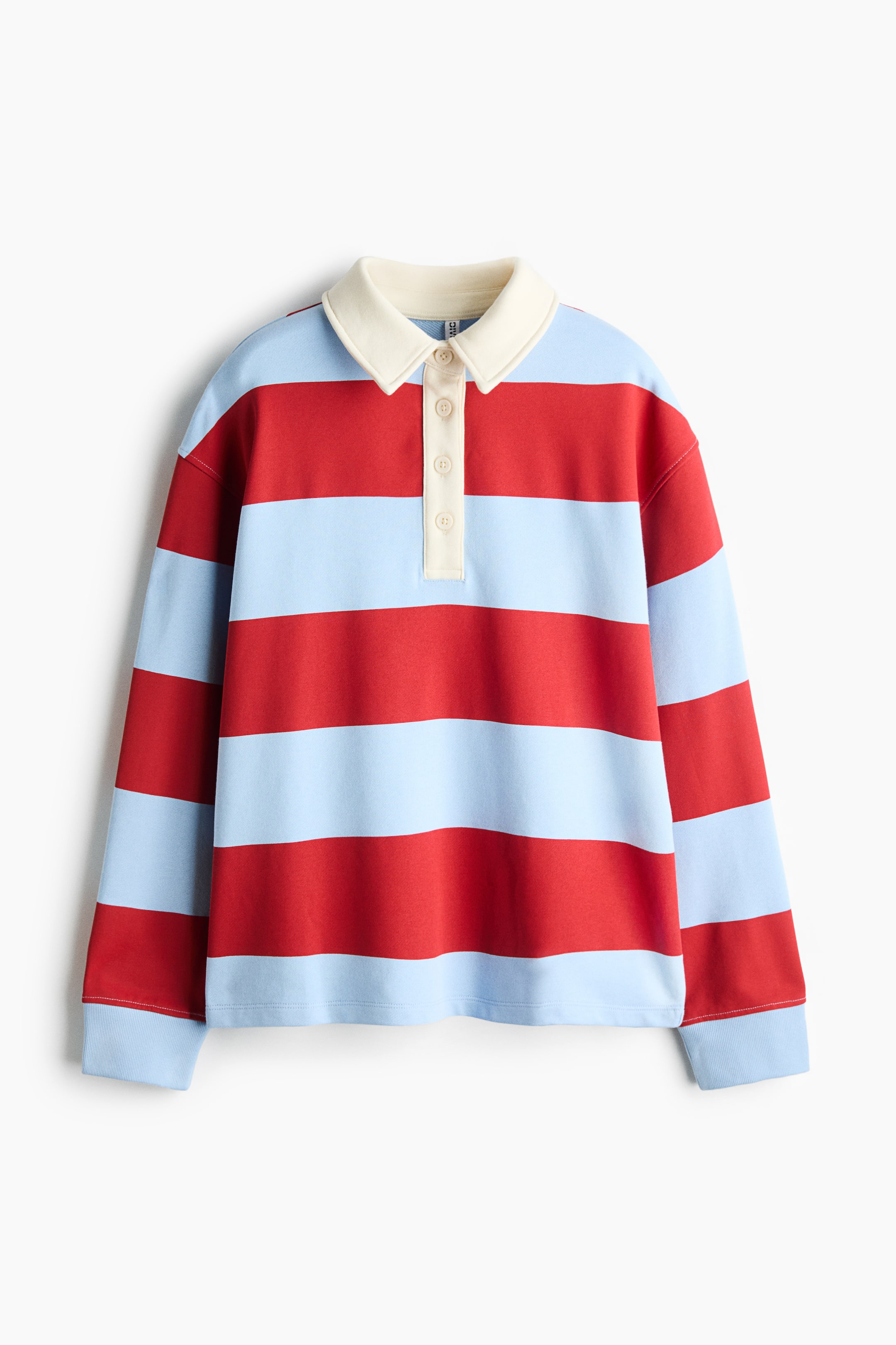 View larger image: A long-sleeved rugby shirt is shown from the front, featuring wide horizontal stripes in alternating red and light blue. The shirt has a contrasting cream-colored polo collar with a matching four-button partial placket and light blue ribbed cuffs.
