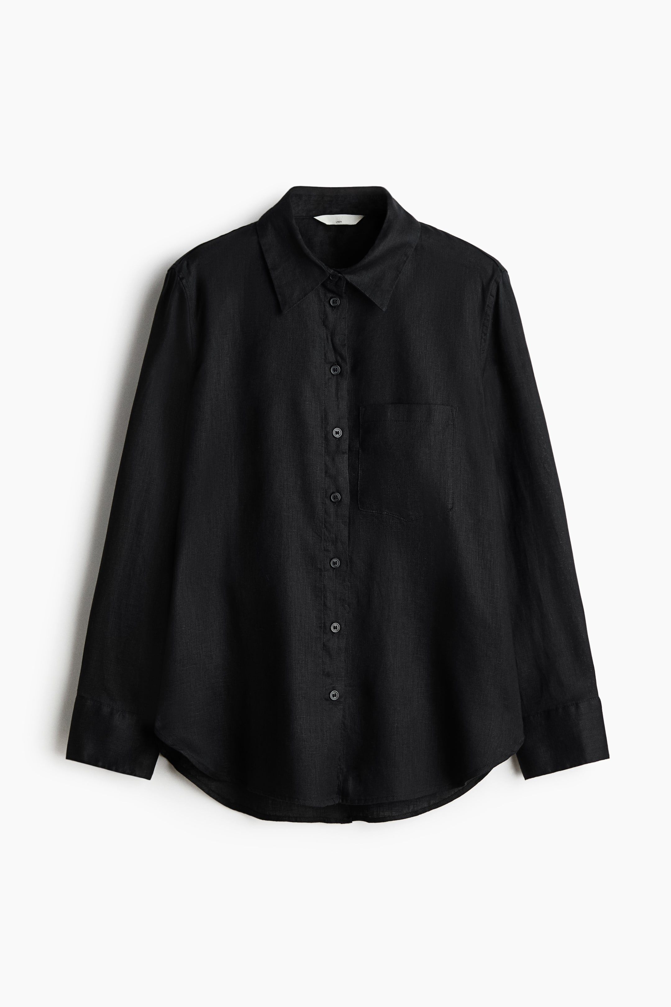 View larger image: Presenting a black linen shirt from the FRONT, this piece features a collar and buttons running down the front. It showcases an open chest pocket on the left side, long sleeves with buttoned cuffs, and a straight-cut hem complemented by curved side vents.