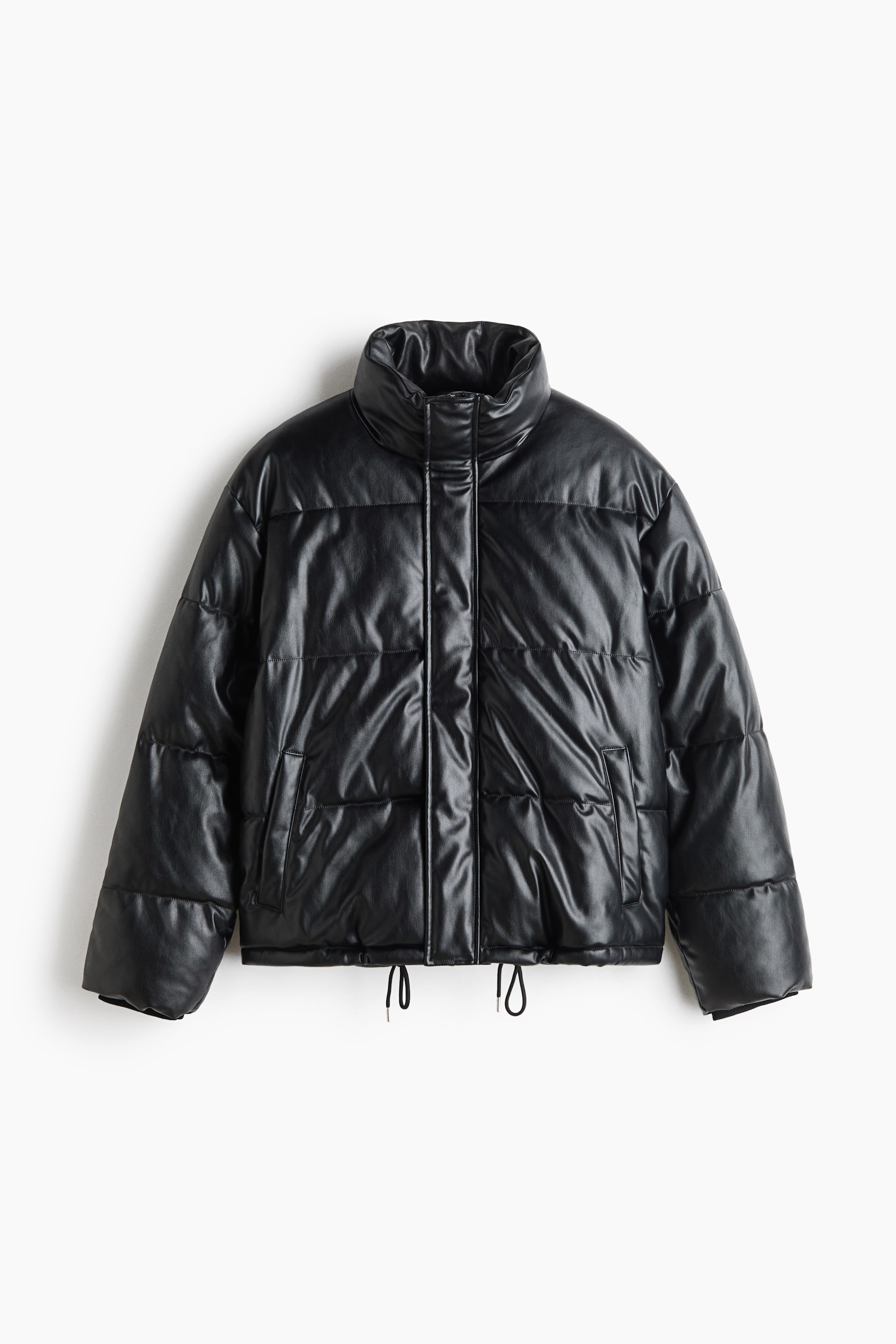 View larger image: A boxy black puffer jacket in a coated, leather-like fabric features a high stand collar, horizontal quilting, and dropped shoulders in a front-facing view. It has a concealed front fastening, welt side pockets, and adjustable drawstring cords hanging from the hem.