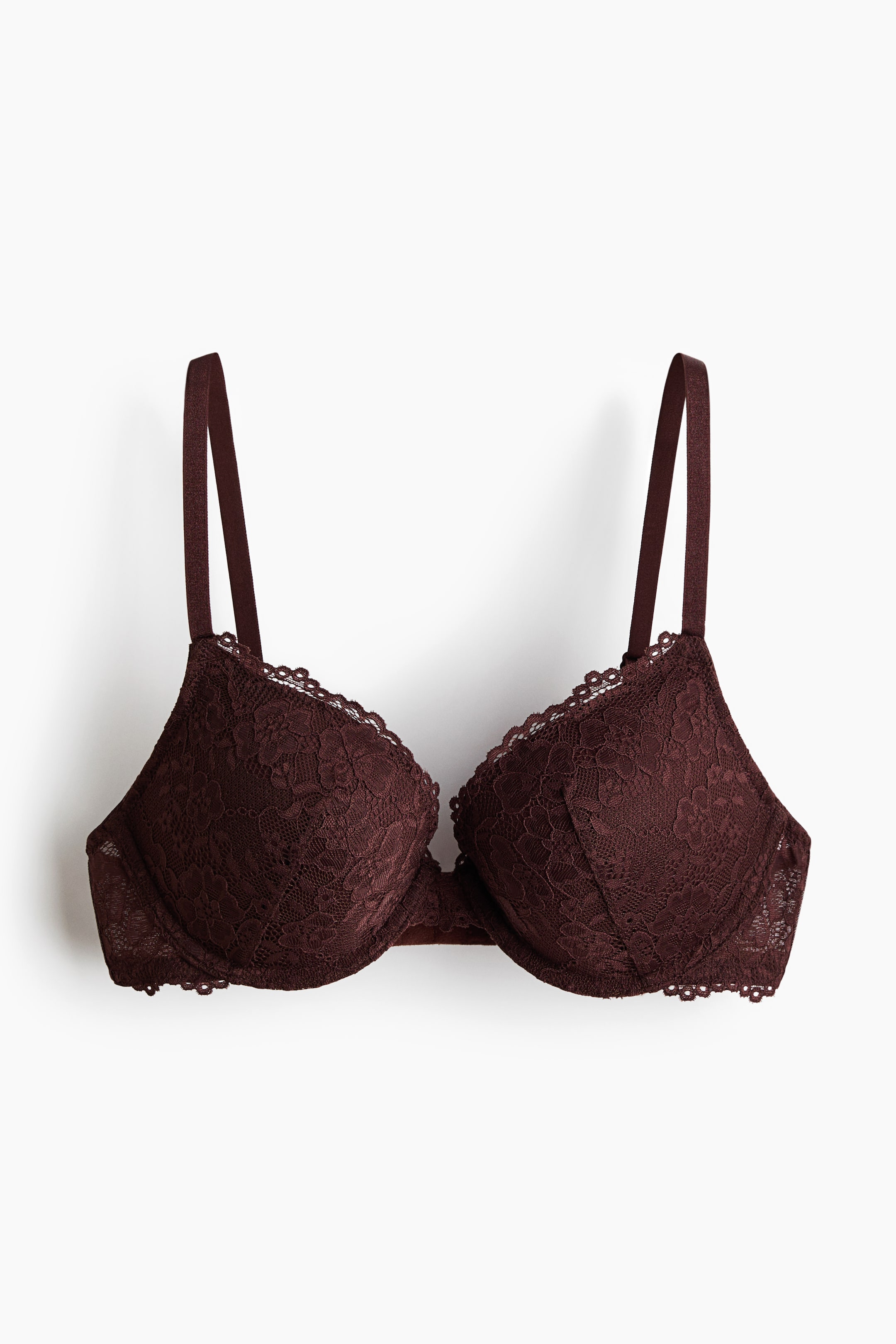 View larger image: A dark brown lace push-up bra is presenting from the front, featuring adjustable shoulder straps and underwired, padded cups with scalloped lace trim along the top edge.