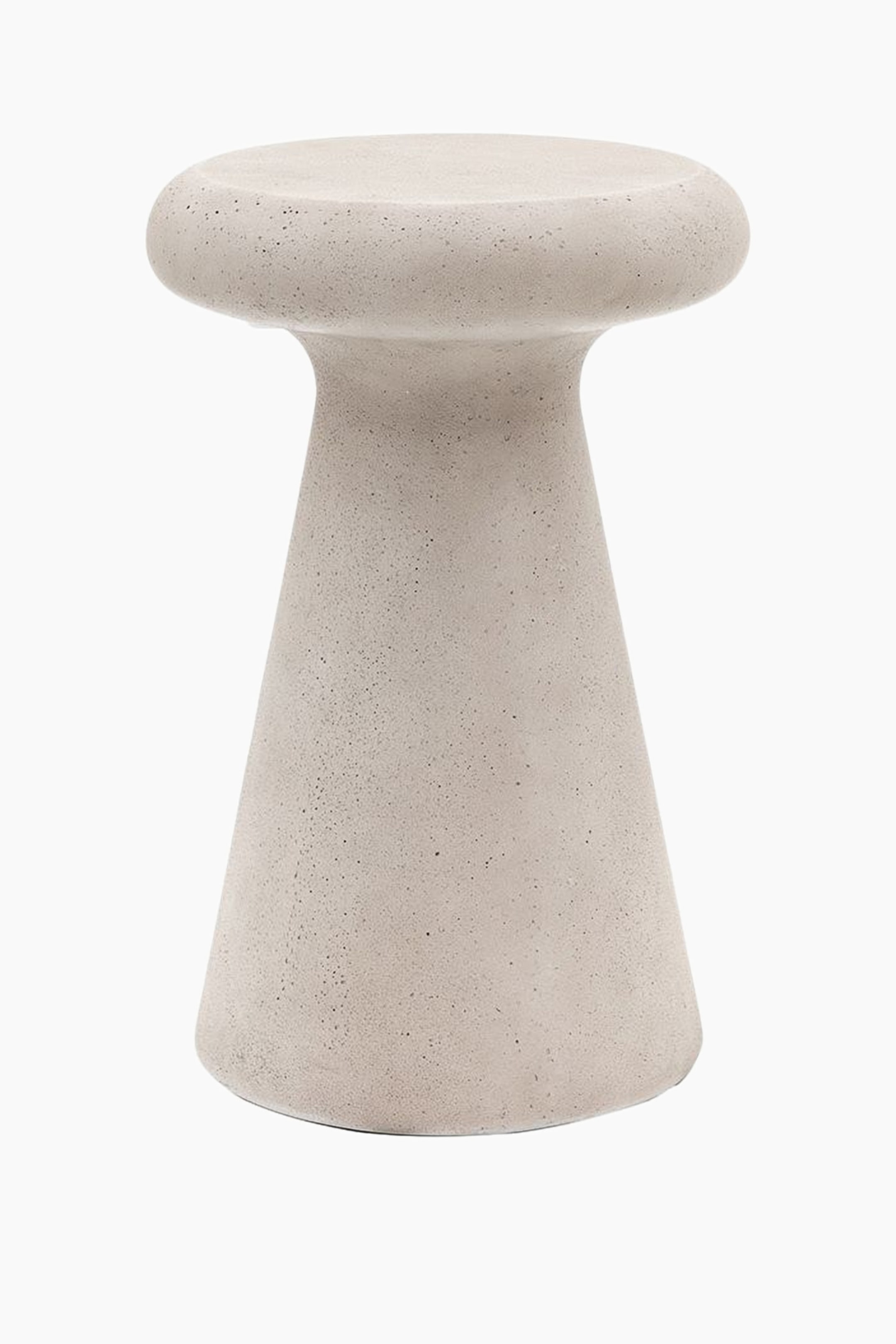 View larger image: A light grey stool is facing slightly to the right, featuring a rounded, flat top that narrows into a concave neck before flaring out to a conical base. Its surface exhibits a speckled, porous texture.