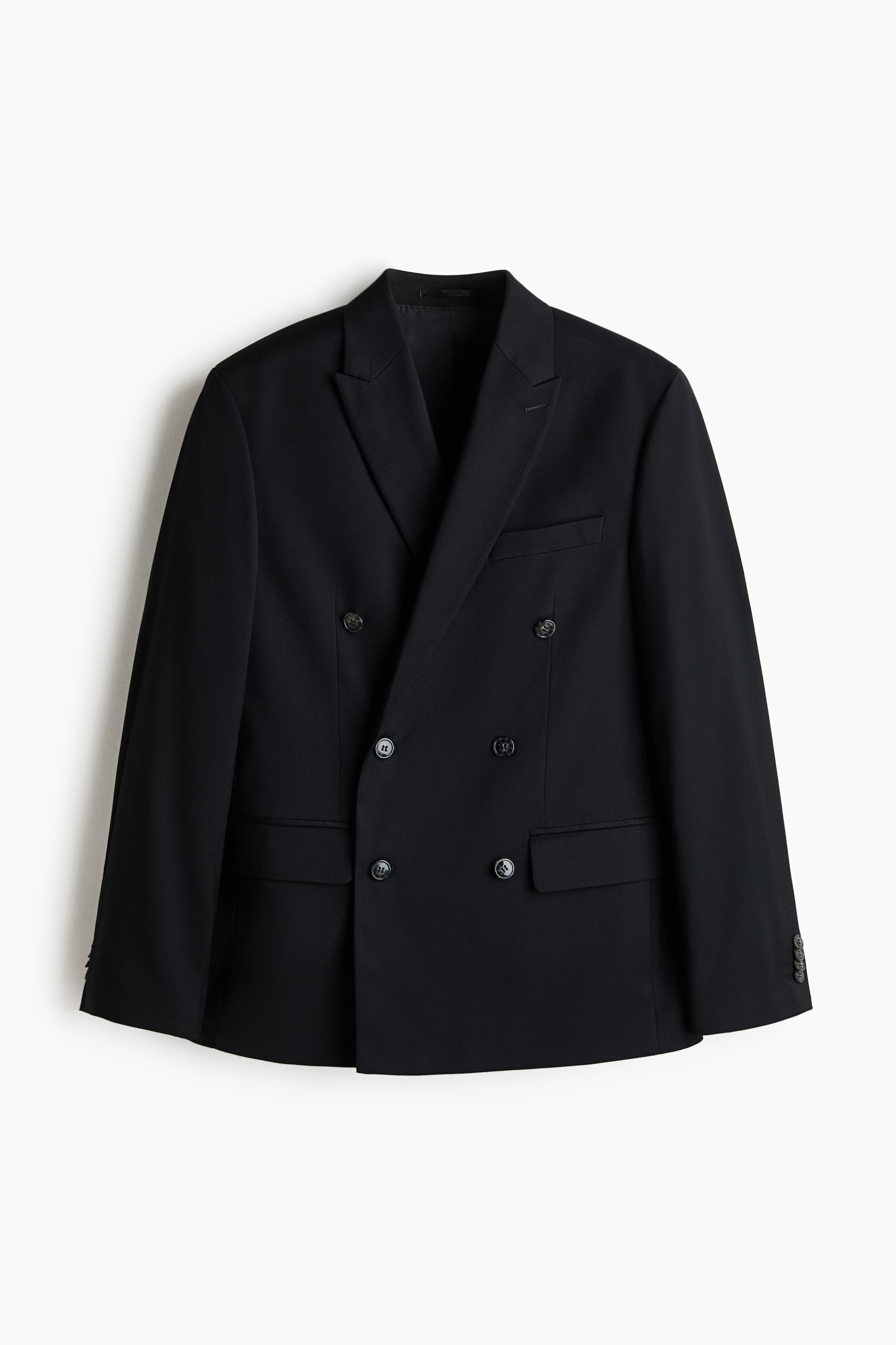 View larger image: A black double-breasted jacket in twill fabric is showcased from the front, highlighting peak lapels, a chest welt pocket, two front flap pockets, a six-button front closure, and decorative buttons on the cuffs.