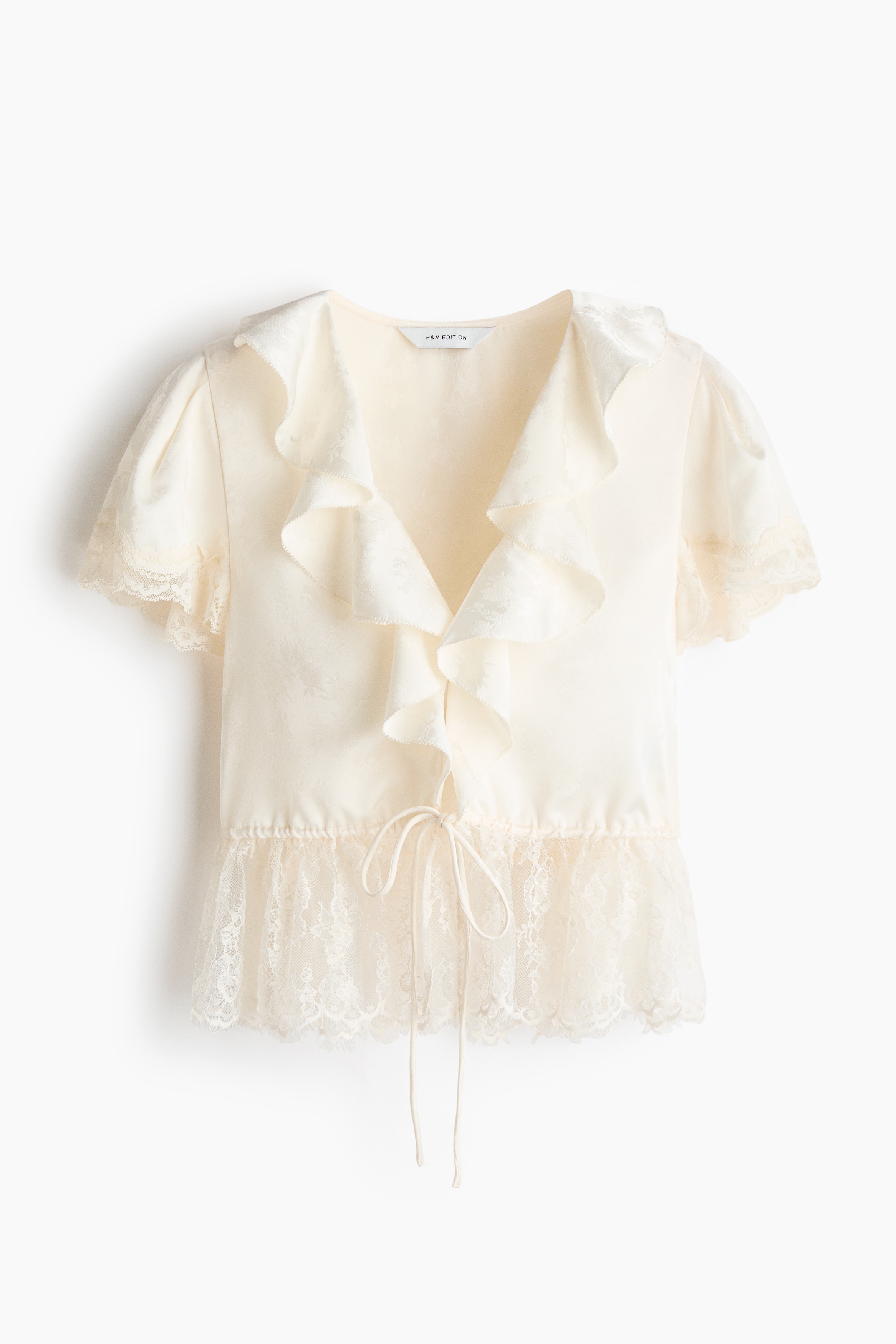Top de manga circular con peplum - Crema
