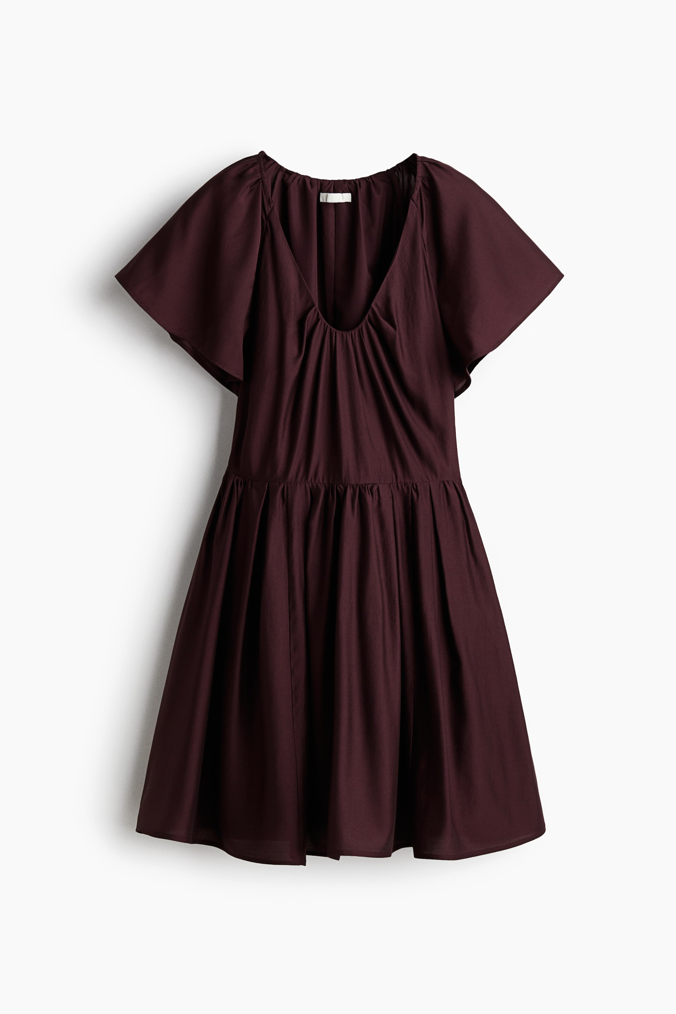 View larger image: A maroon dress is shown from the FRONT, featuring a gathered V-neckline and short, wide flutter sleeves. The fitted bodice is transitioning into a full, gathered A-line skirt at the waist.