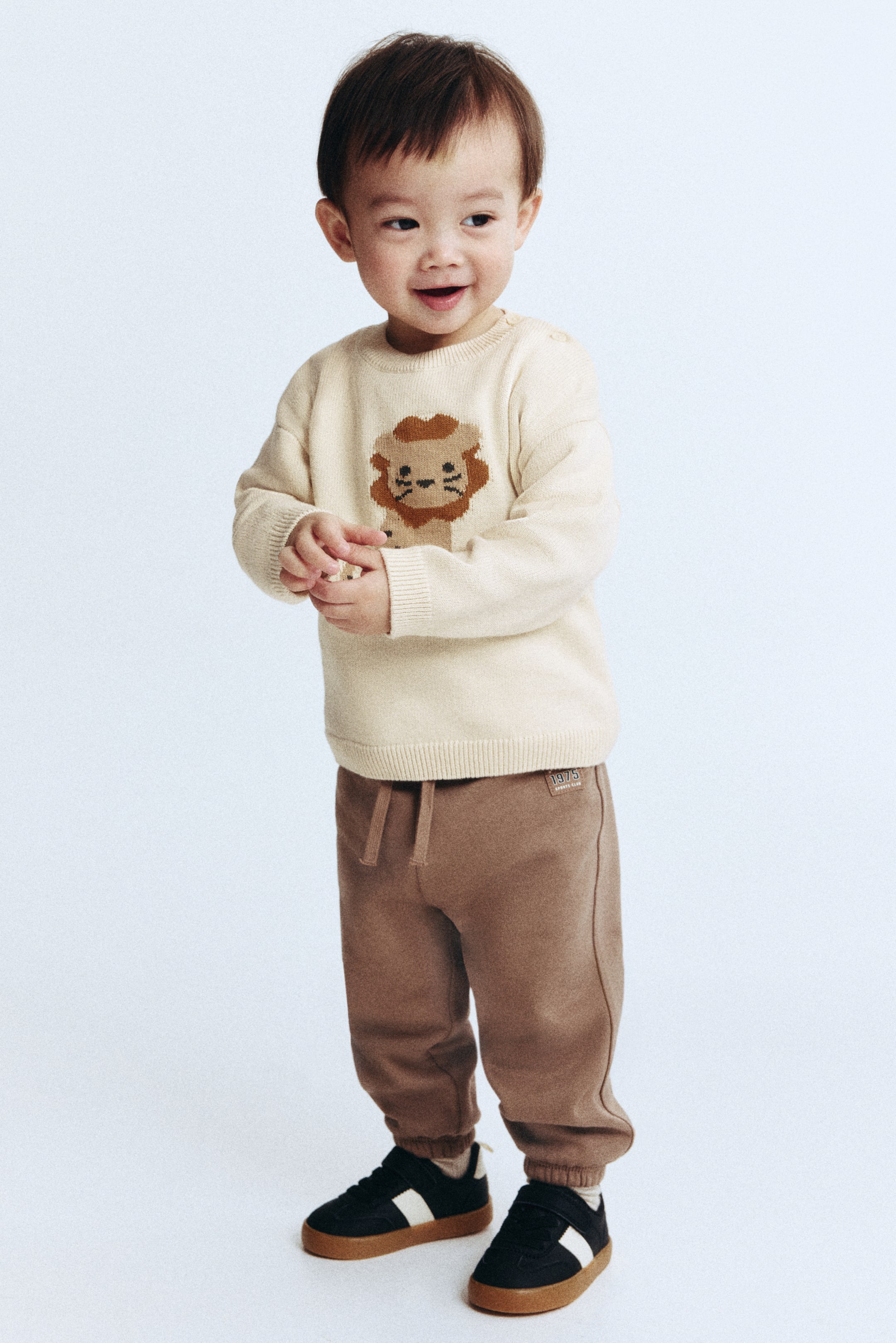 Visualizza immagine più grande: Pullover in maglia di cotone jacquard - Beige chiaro/leone - BAMBINO | H&M IT 1