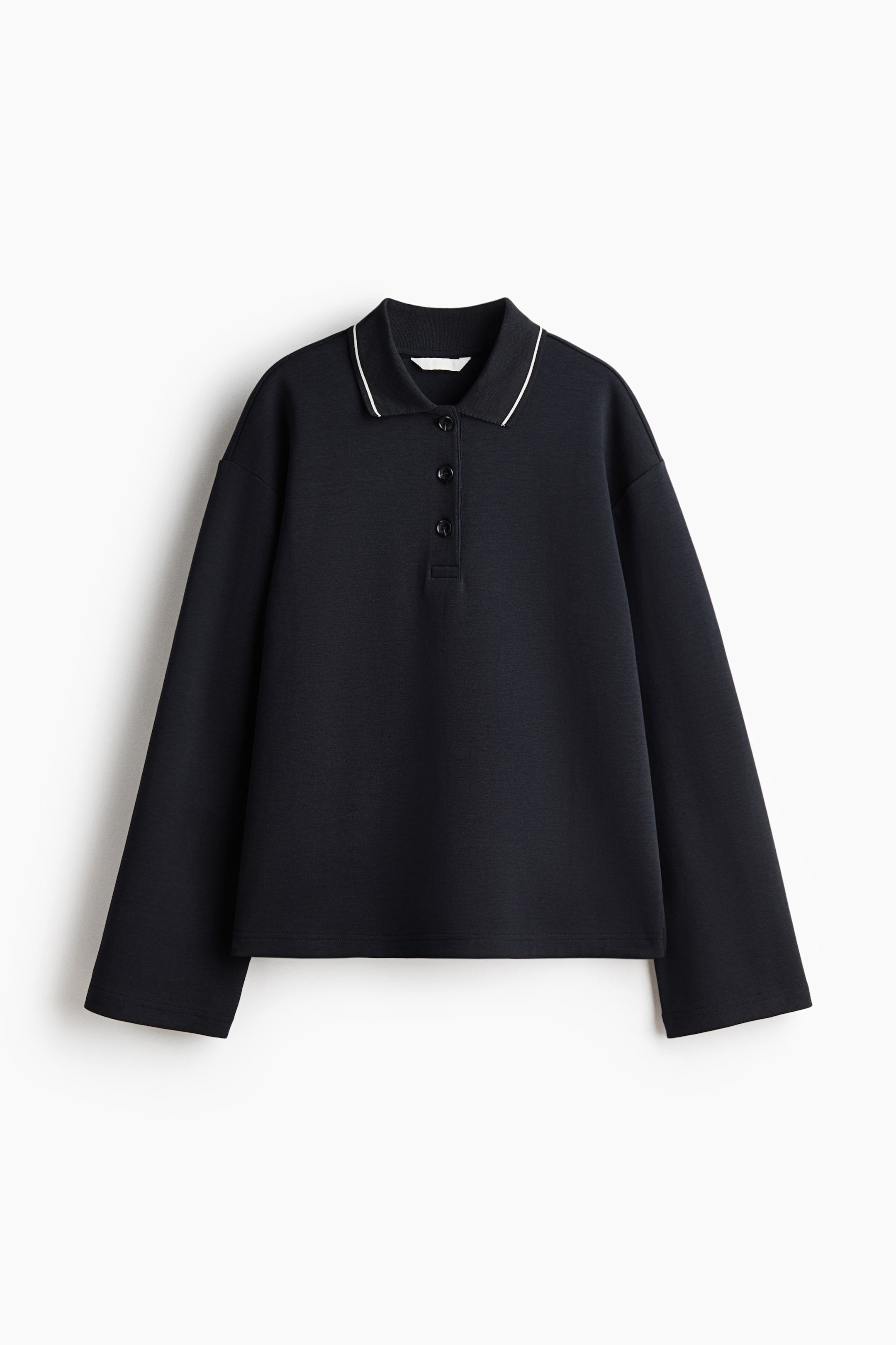 View larger image: This black long-sleeve polo shirt features a pointed collar accented with a white stripe along the edge, a three-button placket, and wide long sleeves, offering a relaxed fit from the front.