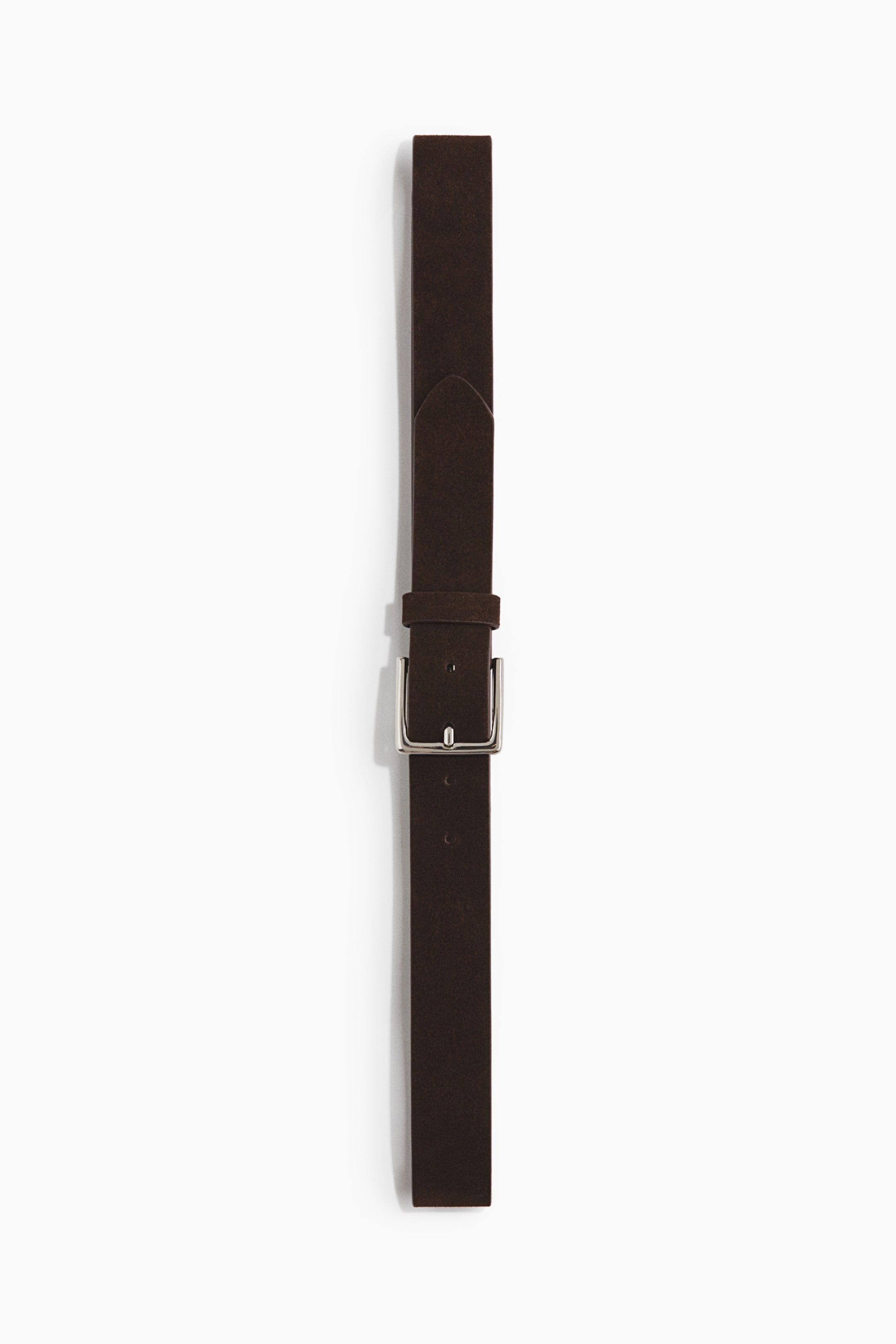 View larger image: A dark brown suede belt is laid out vertically, featuring a silver-tone rectangular buckle and a matching suede keeper.