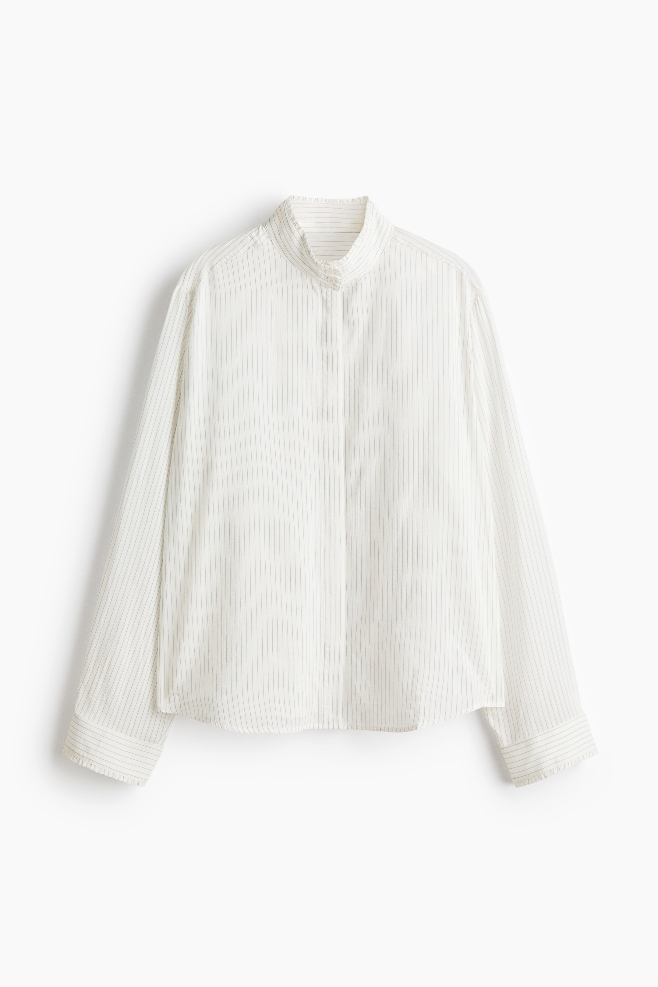 View larger image: A light-coloured shirt in a cotton-blend weave with fine vertical stripes features a buttoned, frill-trimmed stand collar and concealed buttons down the front. It is designed with a back yoke extending over gently dropped shoulders, long sleeves with frill-trimmed cuffs, and a gently rounded hem.