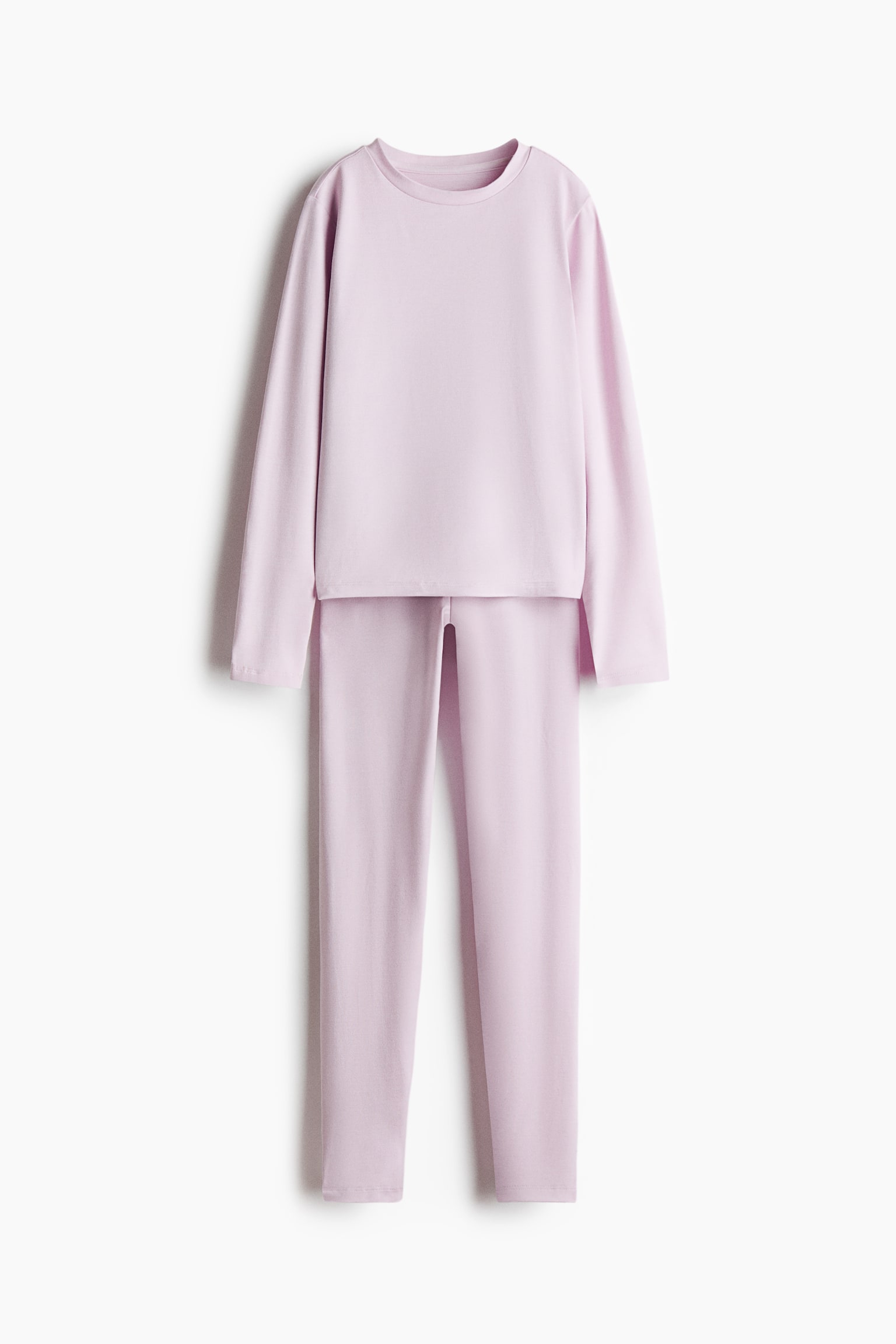 A two-piece loungewear set in pale purple is shown from a front-facing view, featuring a long-sleeve, crew neck top layered over matching fitted leggings. Both pieces display a smooth, solid-colour fabric with clean-finished hems. - 1