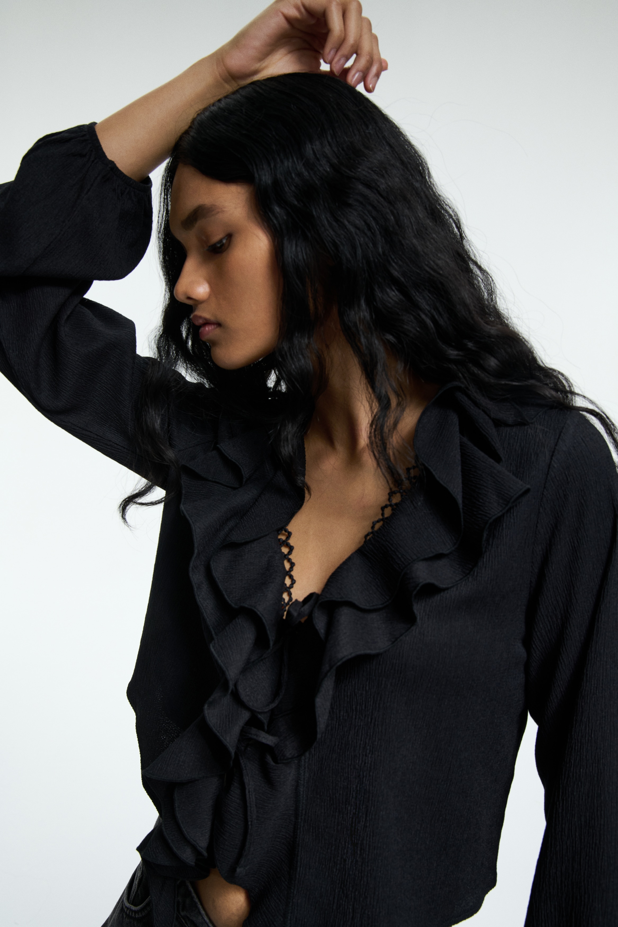 Flounce-trimmed blouse