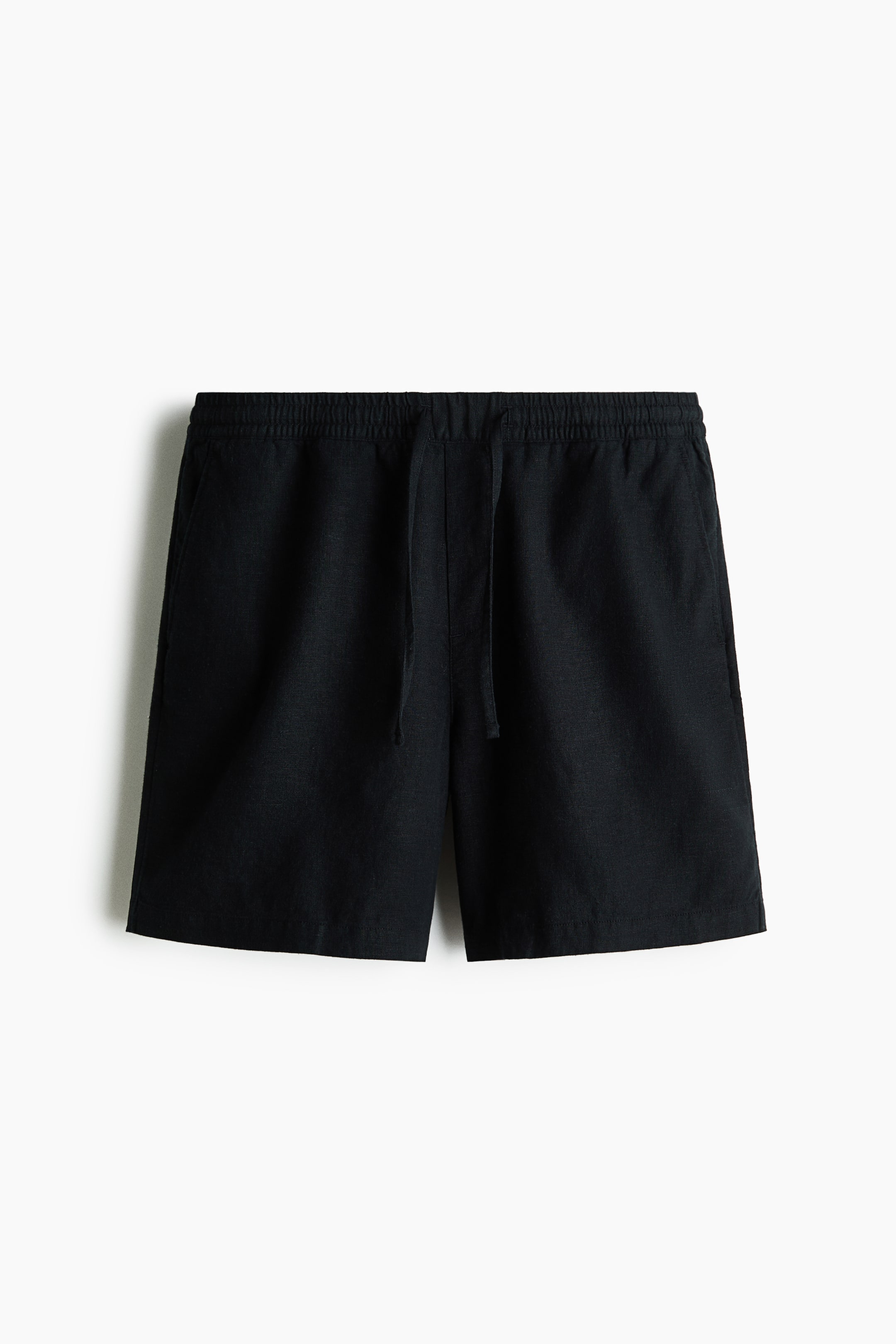 View larger image: Black shorts are shown from the FRONT, featuring an elastic waistband with a drawstring and side pockets.