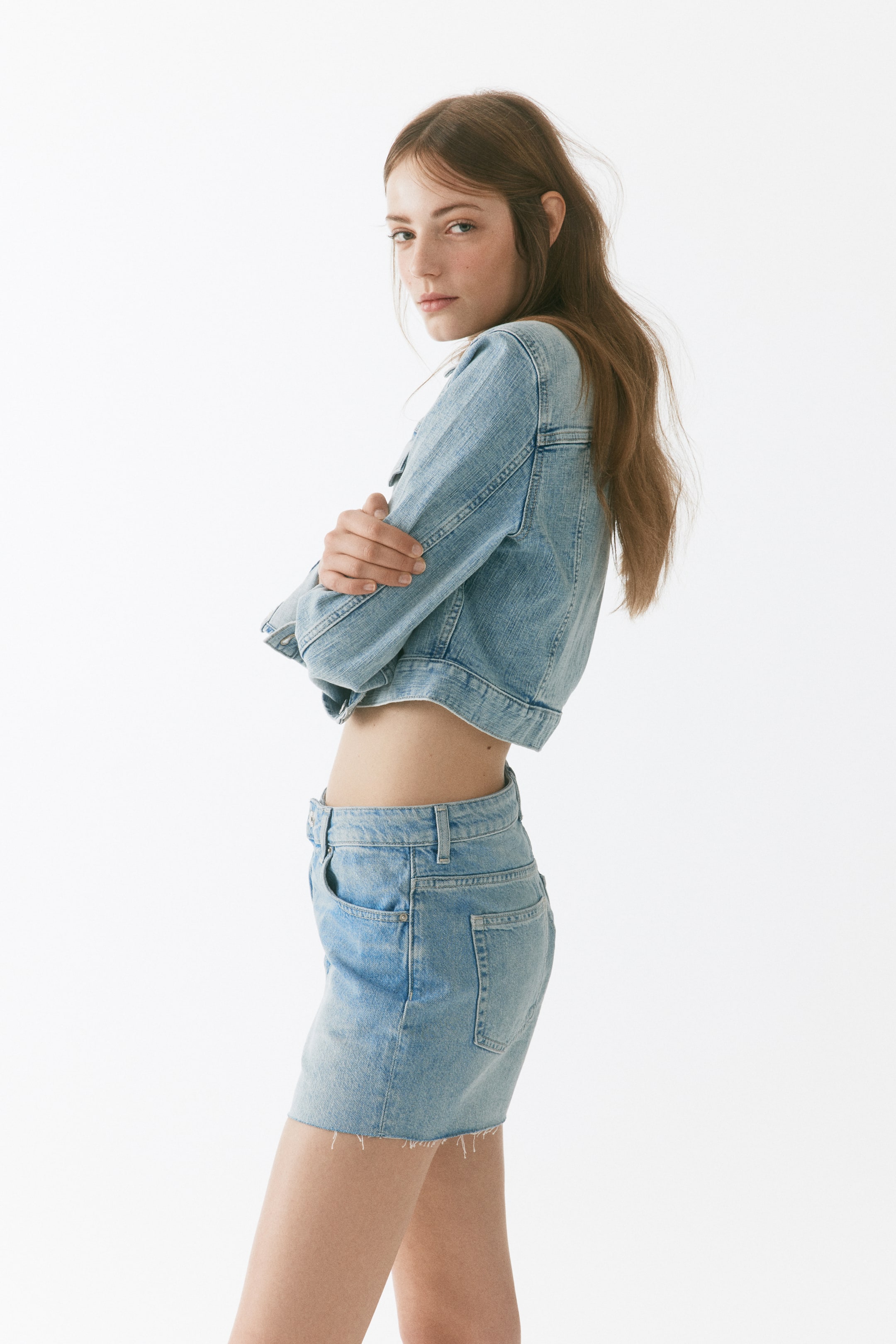Raw-edge denim shorts