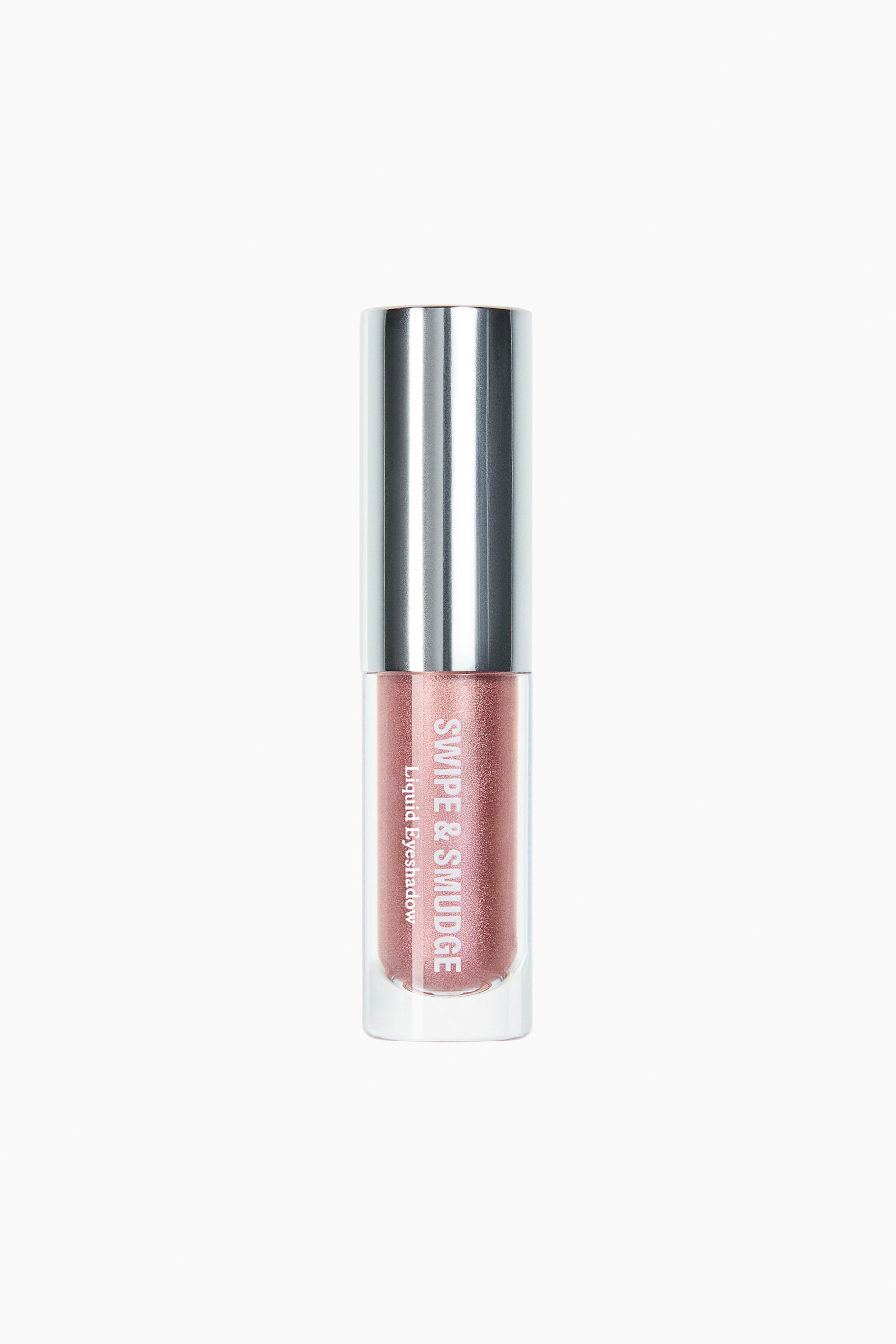 Se større billede: En liquid eyeshadow står oprejst, forfra, i en klar cylindrisk beholder fyldt med en skinnende rosaguldvæske. Den er toppet med et reflekterende, sølvfarvet cylindrisk låg, og ordene 'SWIPE & SMUDGE Liquid Eyeshadow' er synlige lodret på forsiden.