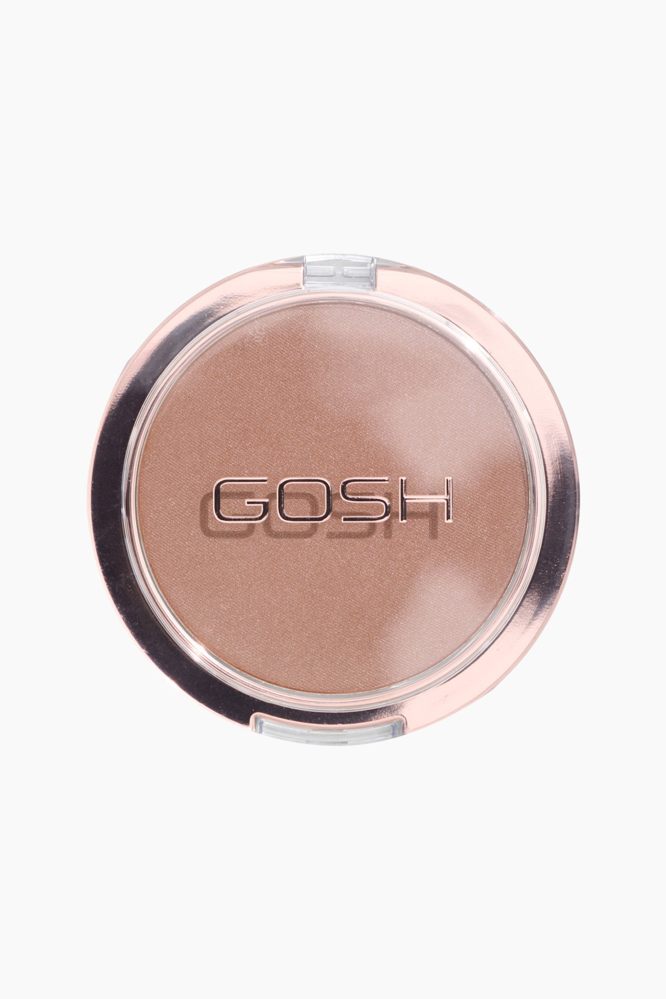 Se større billede: Extra Toasty Bronzer vises i en lukket, rund kompakt med gennemsigtigt låg og en metallisk rosaguld-kant. Det pressede pudder indeni viser en varm, mellembrun nuance med en subtil shimmer, mens brandnavnet "GOSH" fremstår i metallisk rosaguld-tekst i midten.