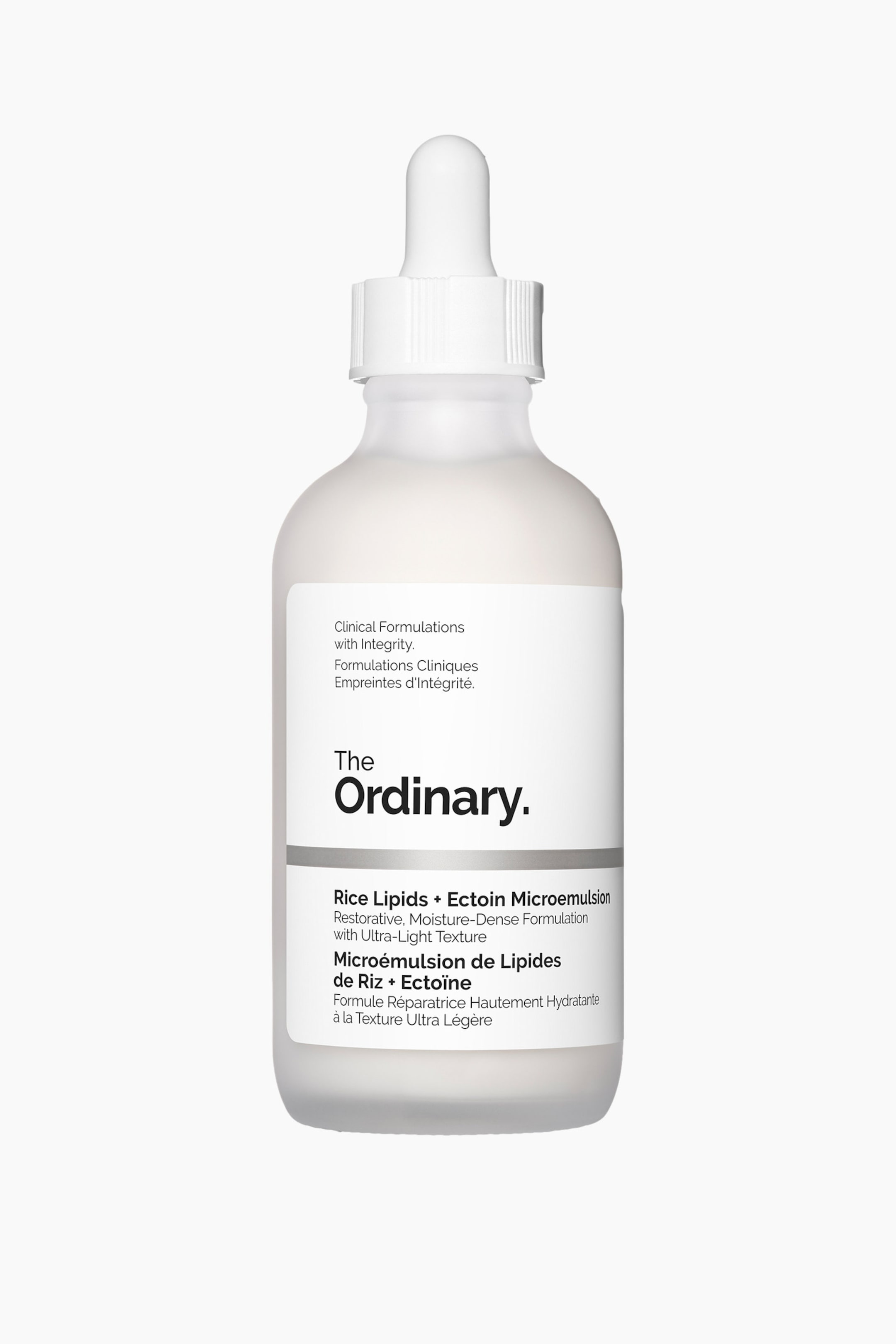 Visa större bild: "The Ordinary Rice Lipids + Ectoin Microemulsion är en frostad glasflaska, vänd framåt, med en vit räfflad pipettkork. En vit rektangulär etikett på framsidan visar varumärkesnamn och produktinformation."