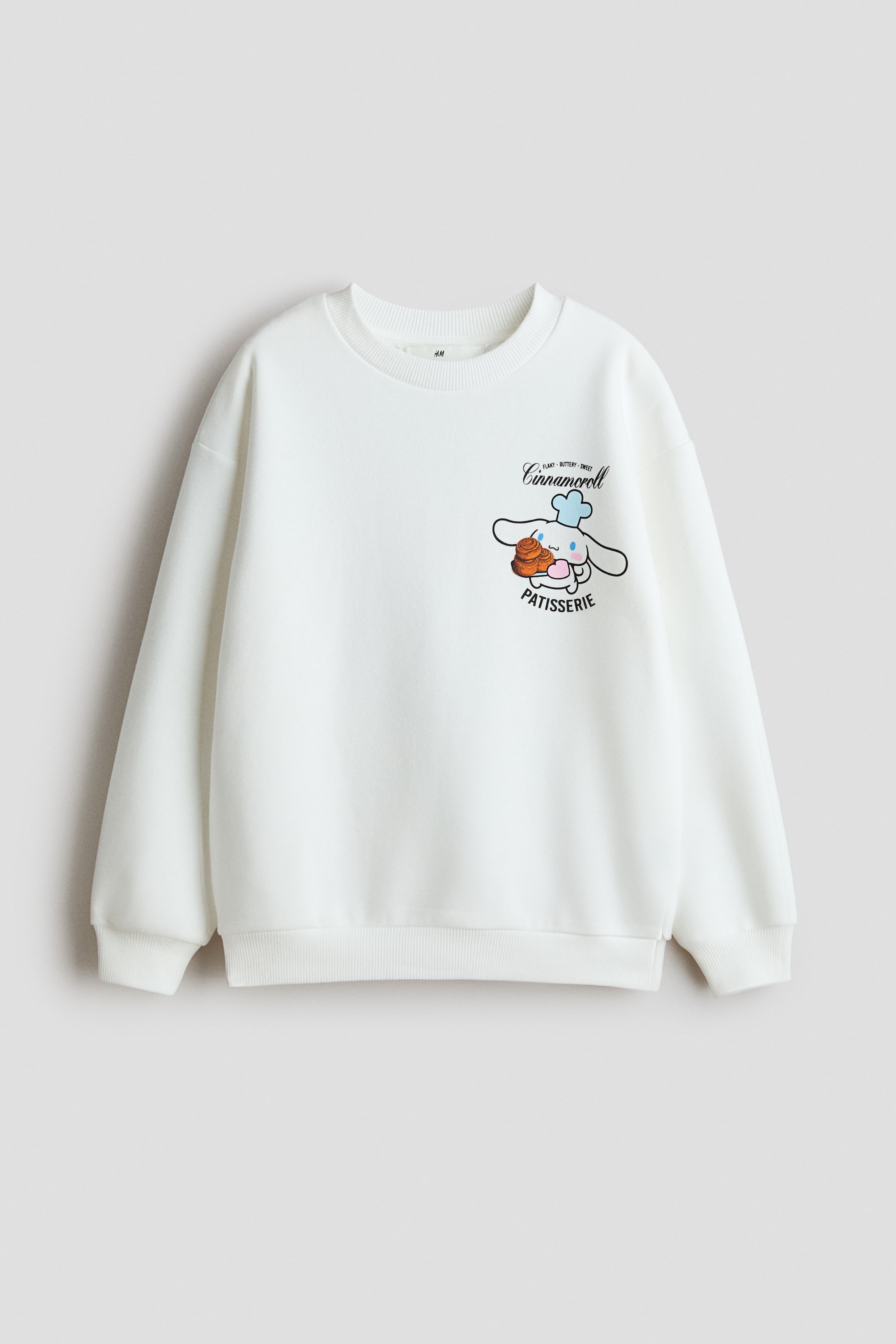 Visa större bild: Oversized sweatshirt med tryckt motiv - Vit/Cinnamoroll - BARN | H&M FI 1