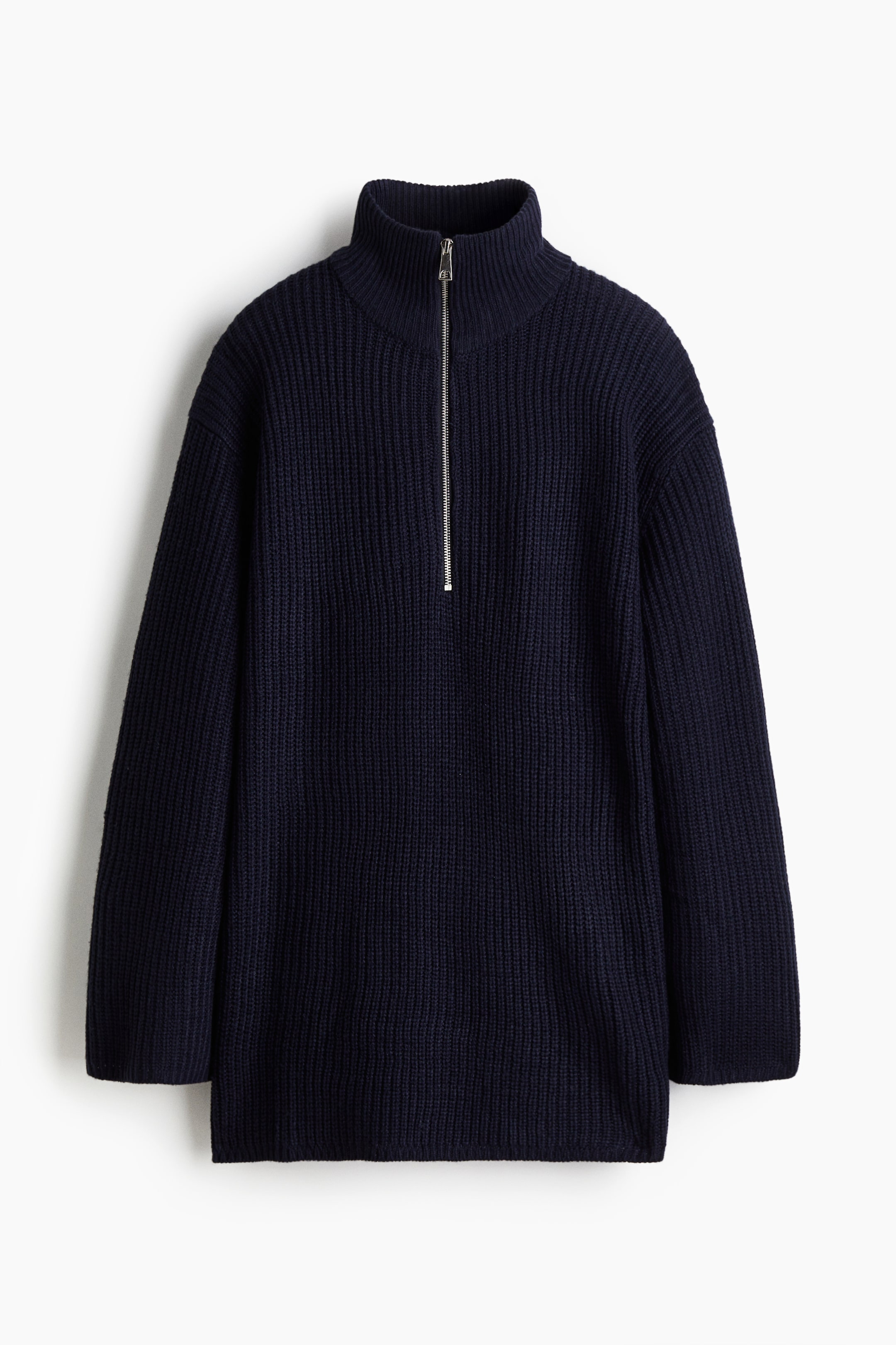 View larger image: A navy blue jumper is being presented FRONT, featuring a soft, chunky ribbed knit, a high, double-layered collar, and a silver-toned zip closure at the top. It has a loose fit, low dropped shoulders, long sleeves, and narrow ribbing at the collar, cuffs, and hem.