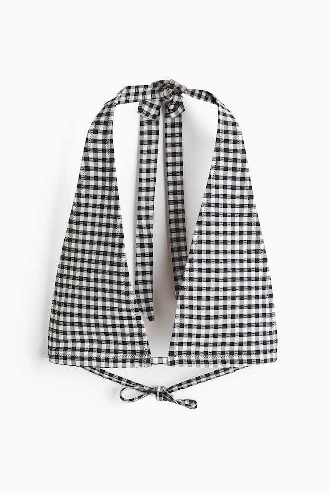 A black and white gingham triangle bikini top is facing front. It features ties at the neck and at the back, which are knotted. - 1