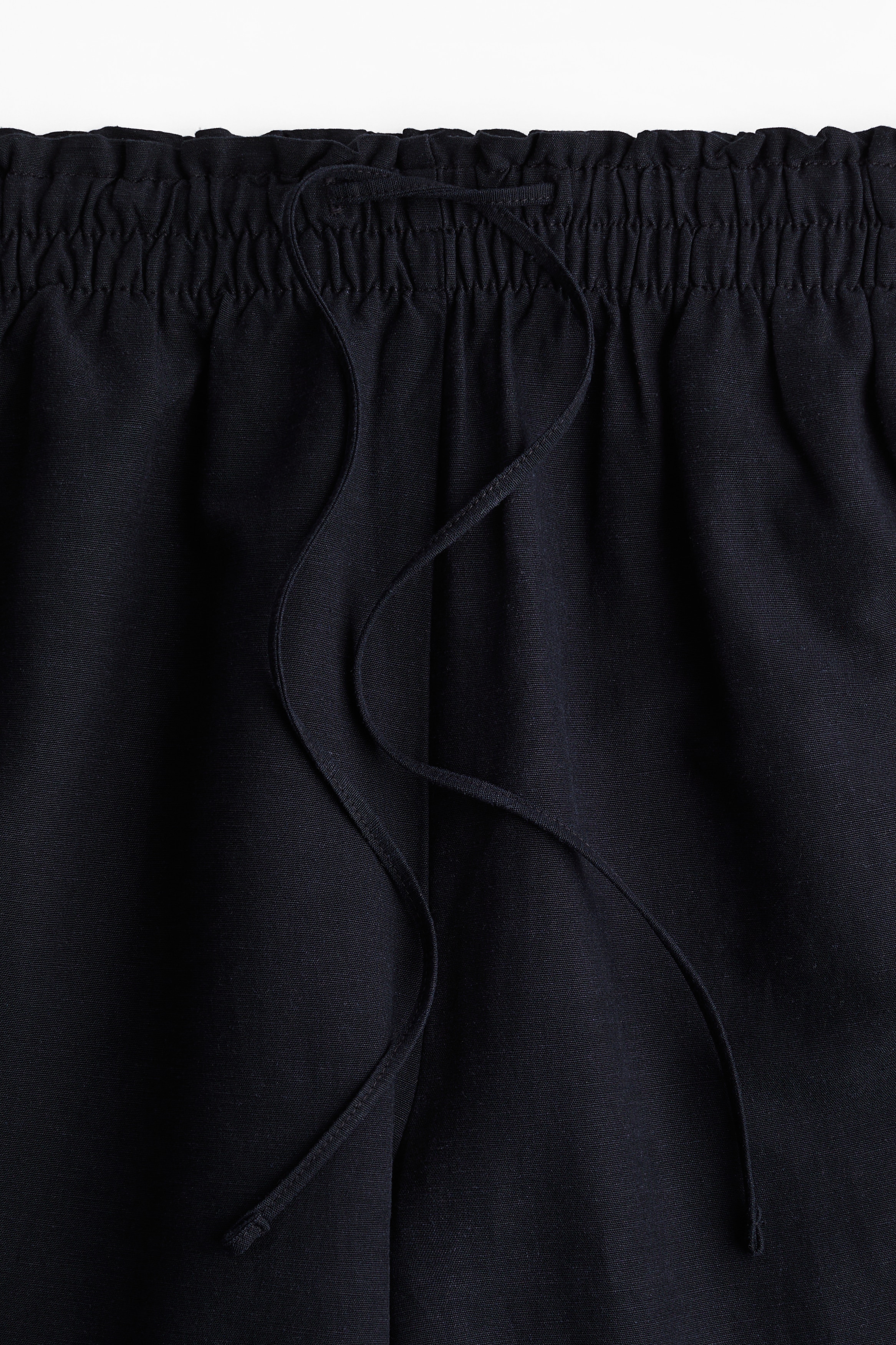 Cropped linen-blend trousers