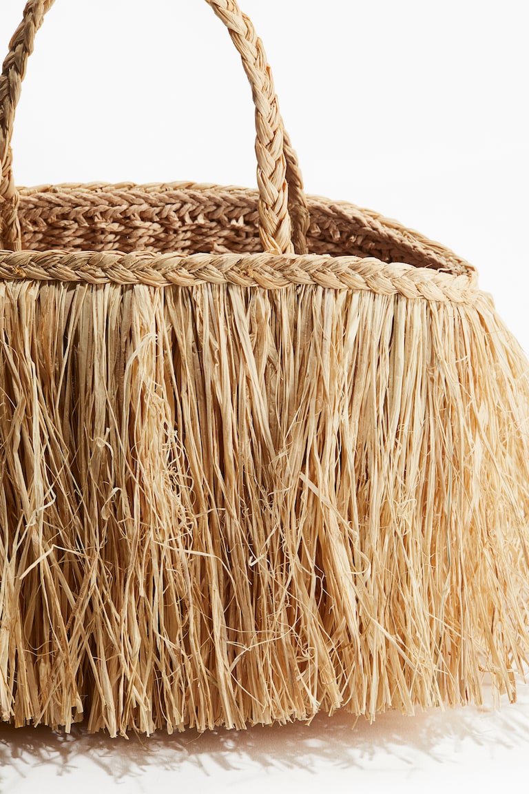 Fringed straw bag