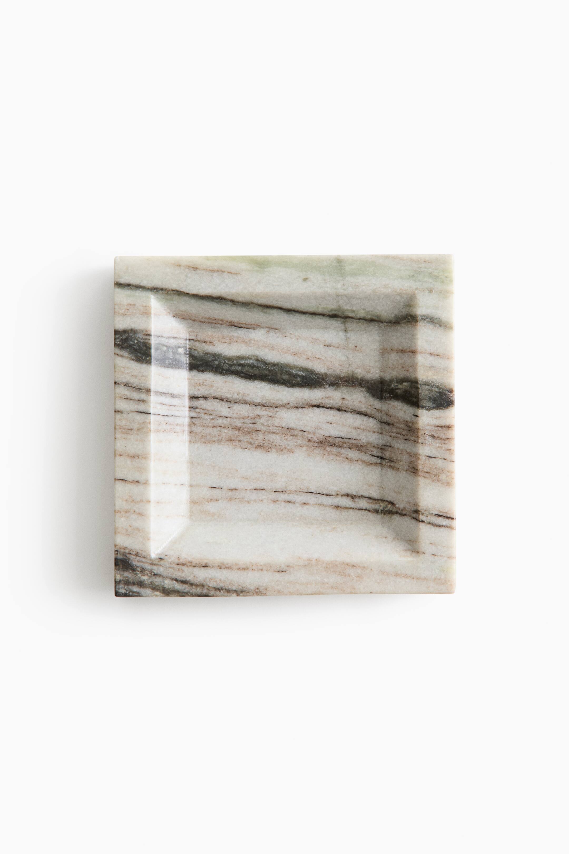 View larger image: A square marble dish is showcasing a recessed square basin with sloped inner edges, viewed from a front overhead angle. The dish displays a natural stone pattern with prominent horizontal veining in shades of cream, brown, and dark grey.